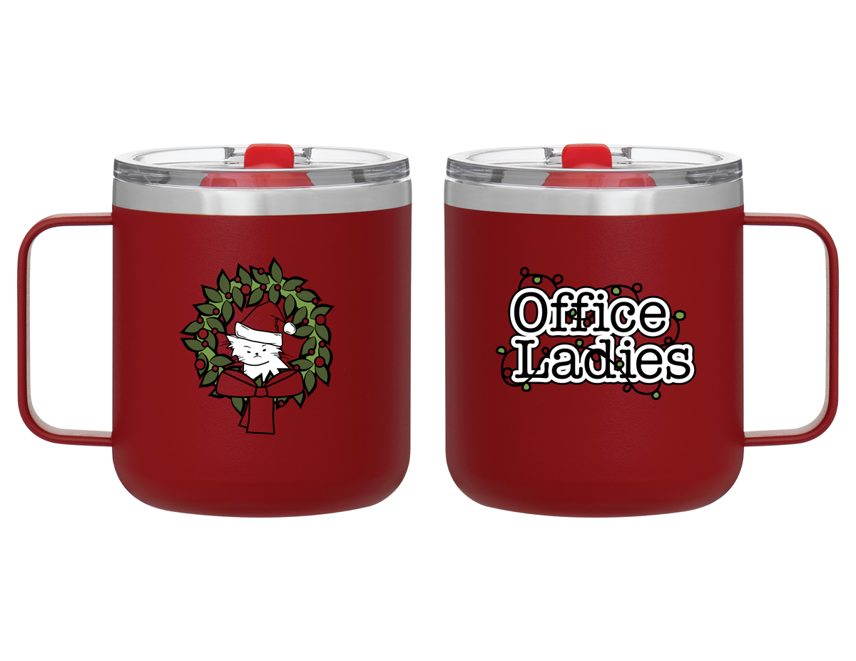 Red mug with a festive design featuring a cat in a Santa hat surrounded by a wreath on one side, and the text 'Office Ladies' with holiday decorations on the other side.