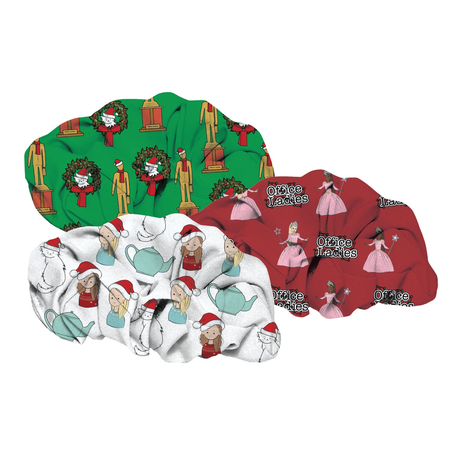 Three scrunchies featuring various holiday-themed patterns: one with festive decorations and characters in green, another with illustrationsof the Office Ladies and holiday elements in white, and a third in red with characters in dresses labeled 'Office Ladies.'