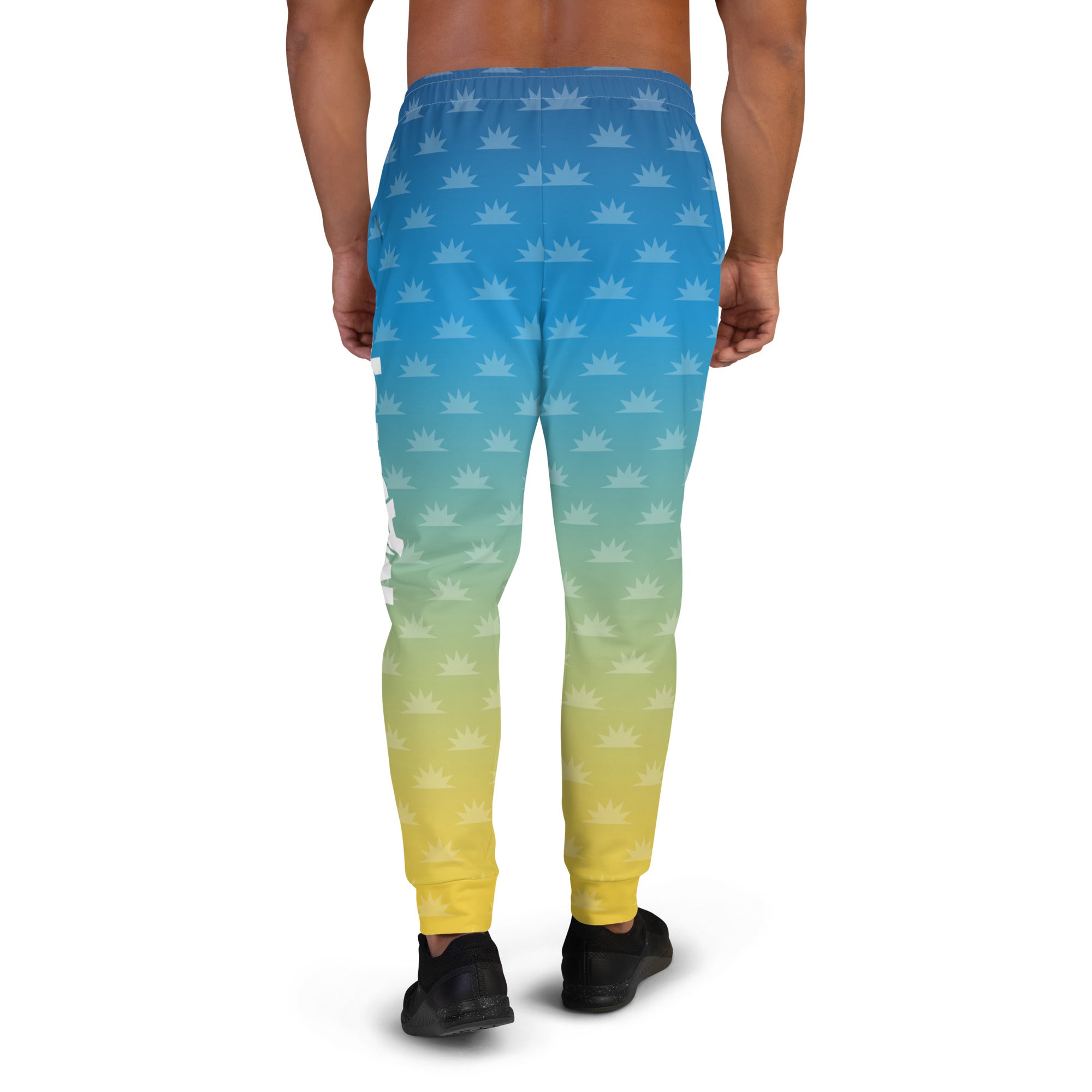 Gradient blue and pink joggers with a crown pattern and the logo 'THE MORNING MASHUP' printed on the side.