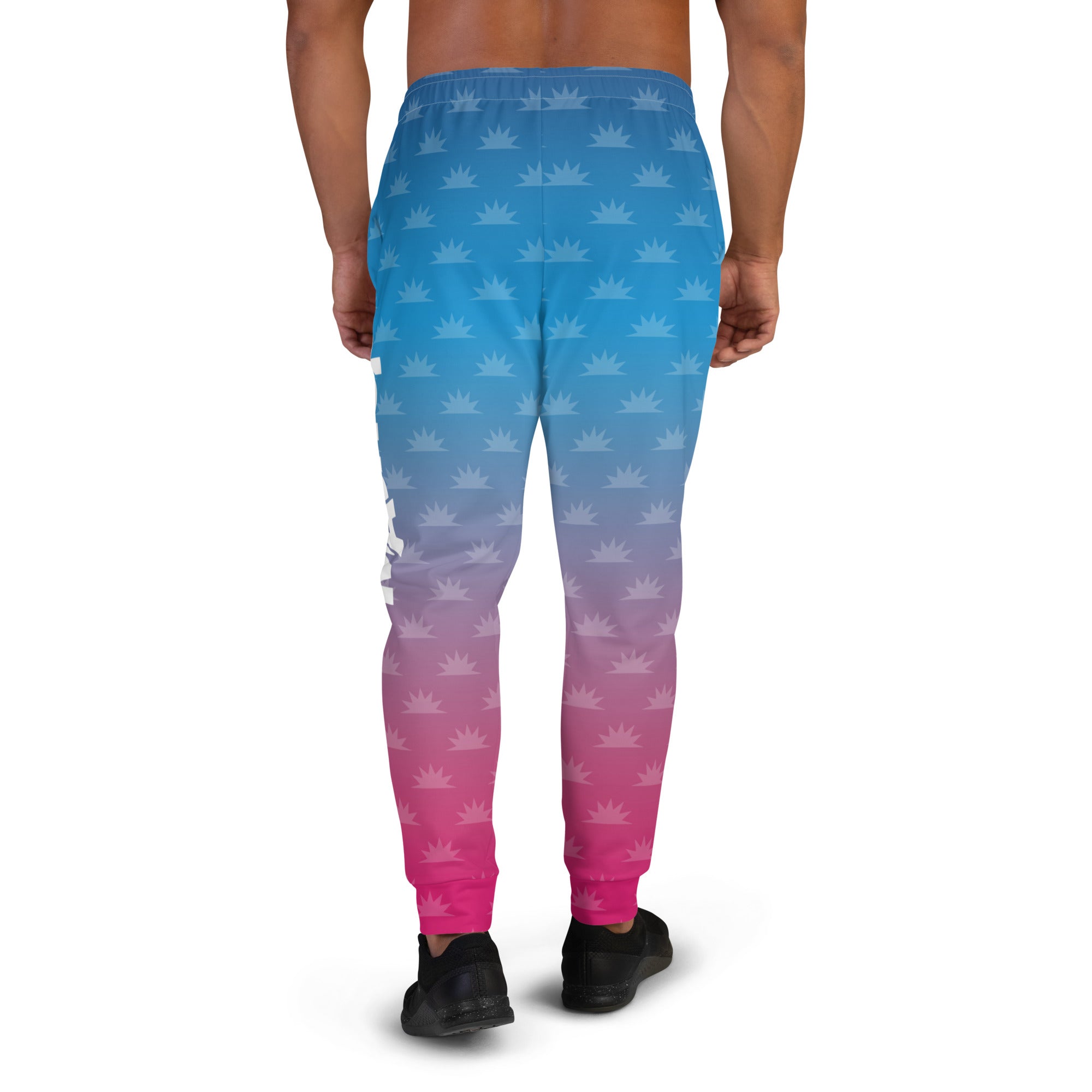 Gradient blue and pink joggers with a crown pattern and the logo 'THE MORNING MASHUP' printed on the side.