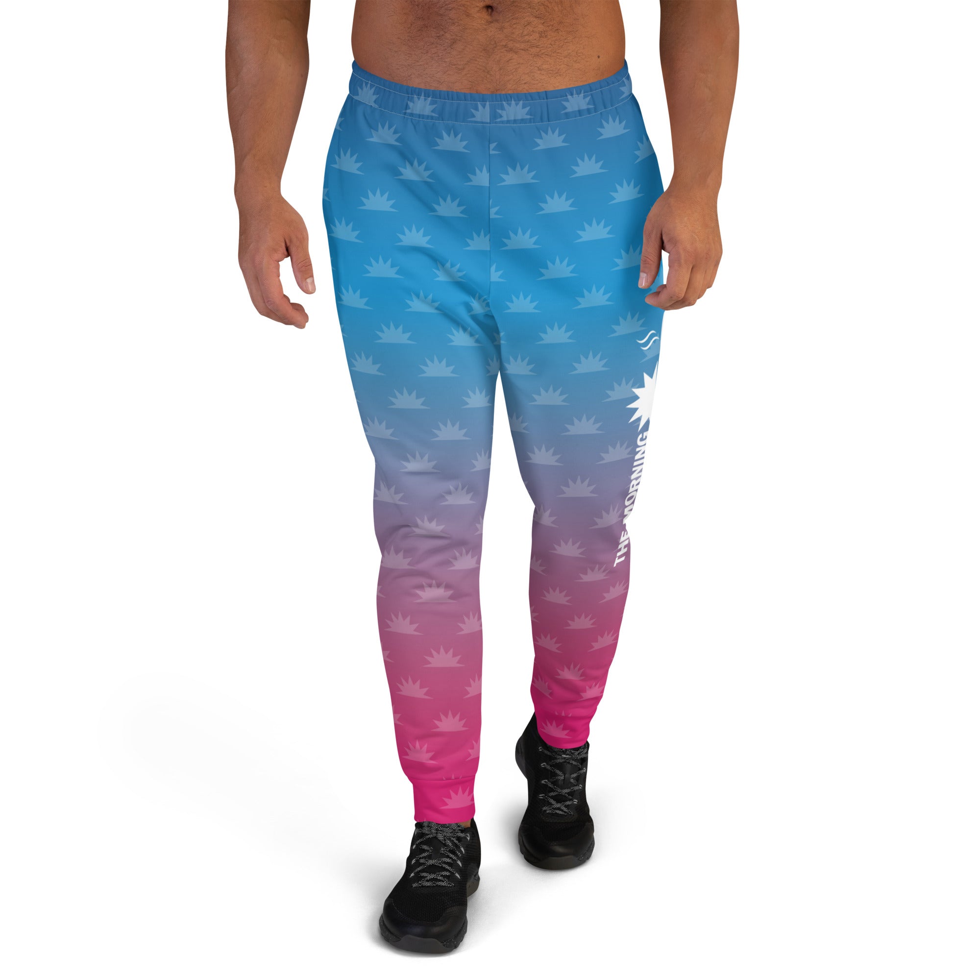 Gradient blue and pink joggers with a crown pattern and the logo 'THE MORNING MASHUP' printed on the side.