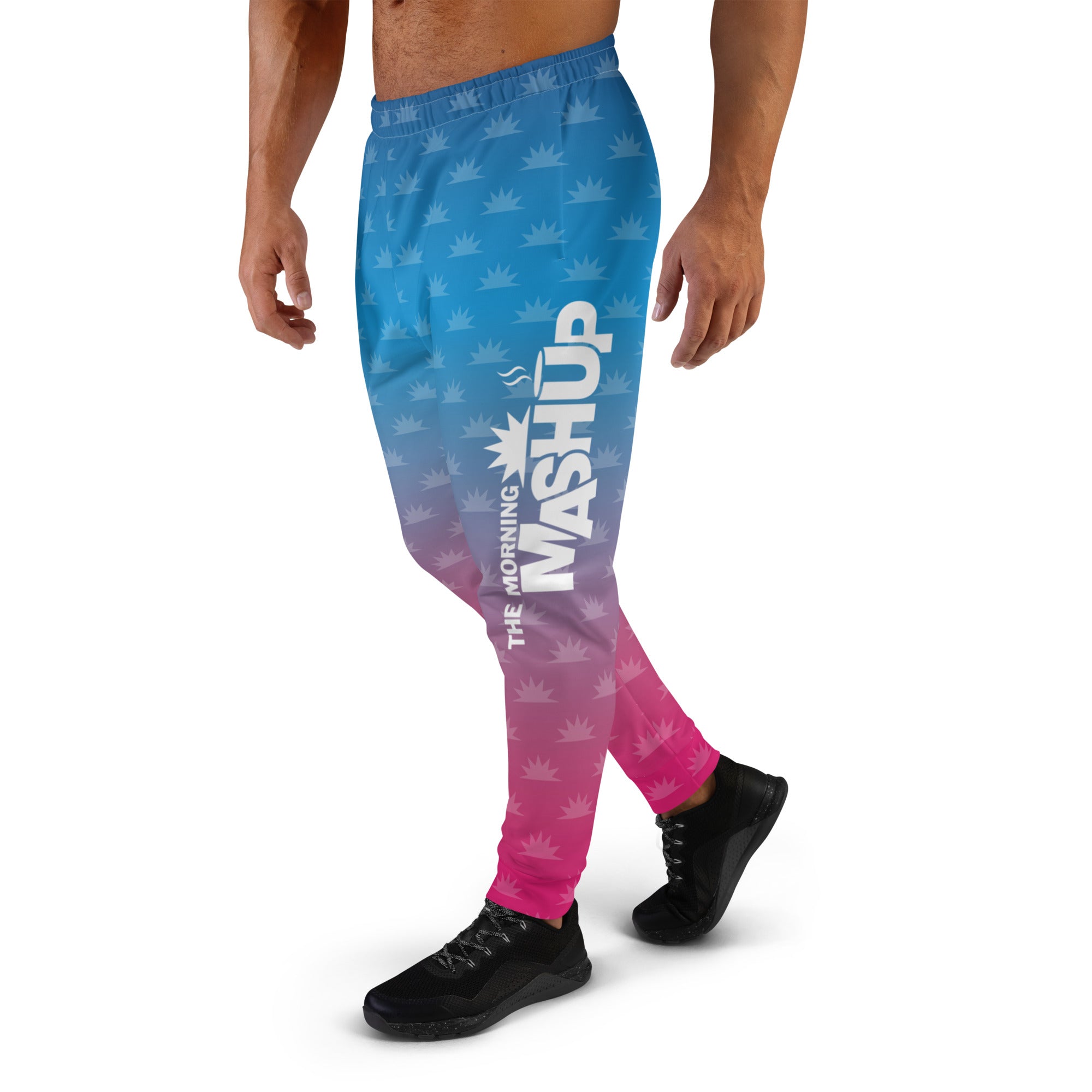 Gradient blue and pink joggers with a crown pattern and the logo 'THE MORNING MASHUP' printed on the side.