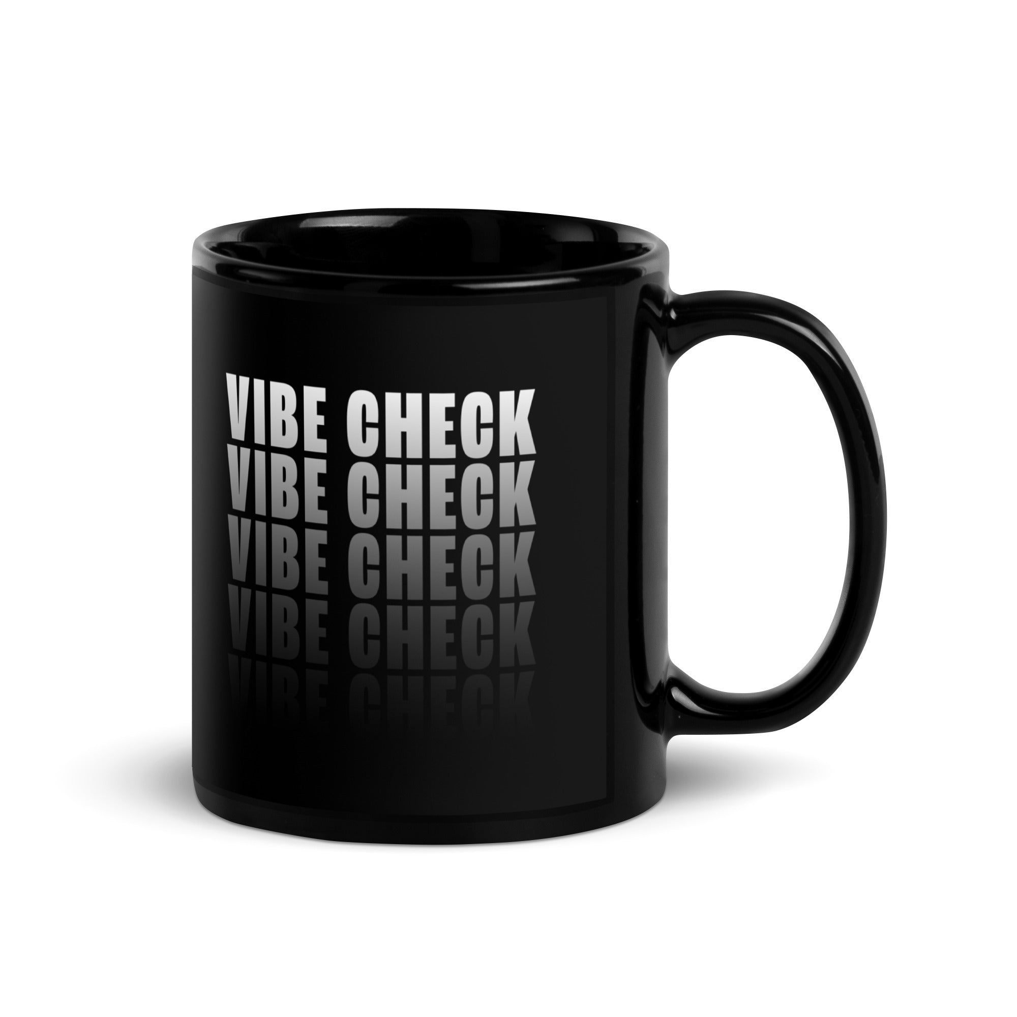 A black glossy coffee mug featuring bold white text that reads 'VIBE CHECK' in a stacked, repeating pattern with a reflection effect at the bottom. The handle is on the right side, and the design is centered on the front of the mug.