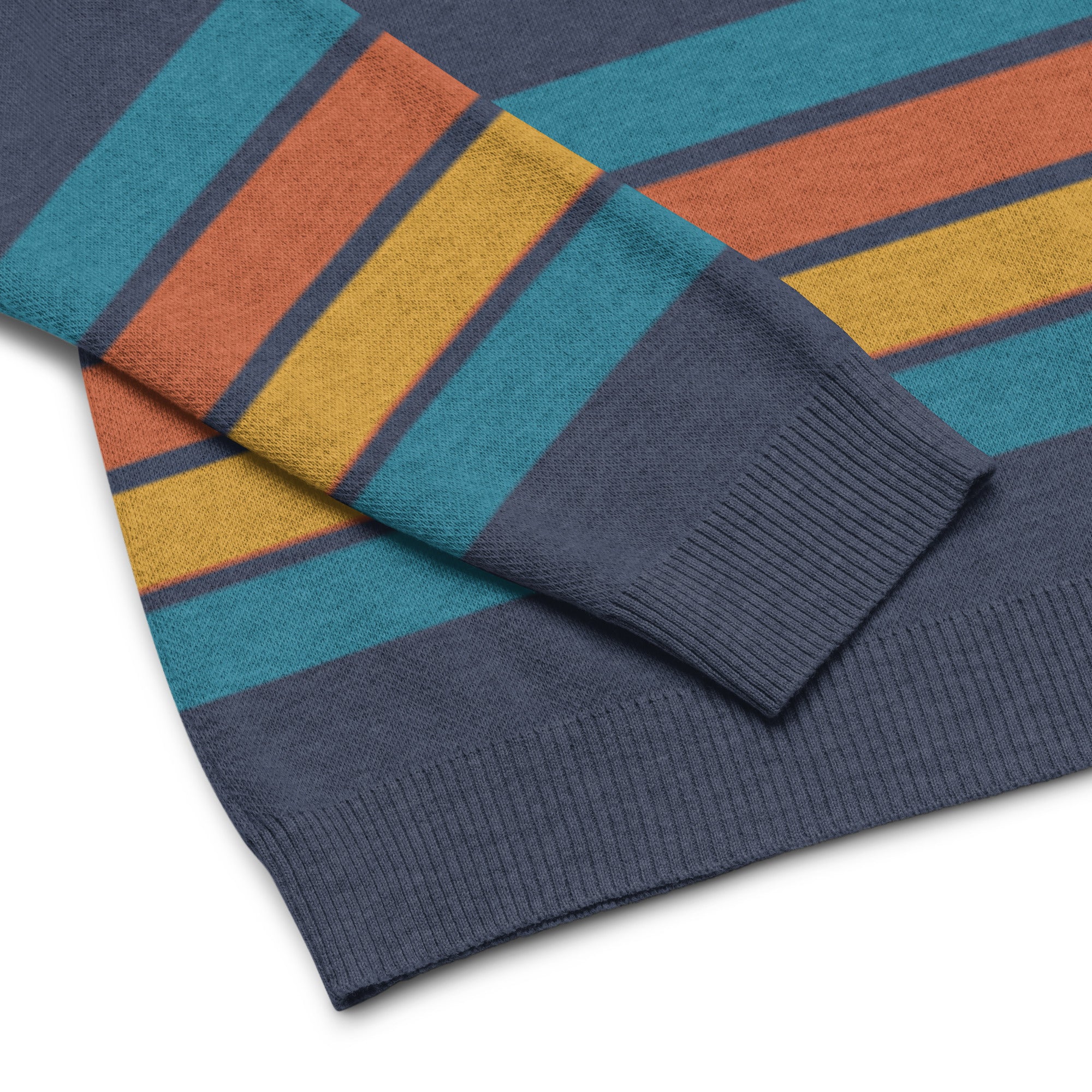 Close up of navy sweater with blue, orange, yellow, and blue stripes at the cuffs and hem.