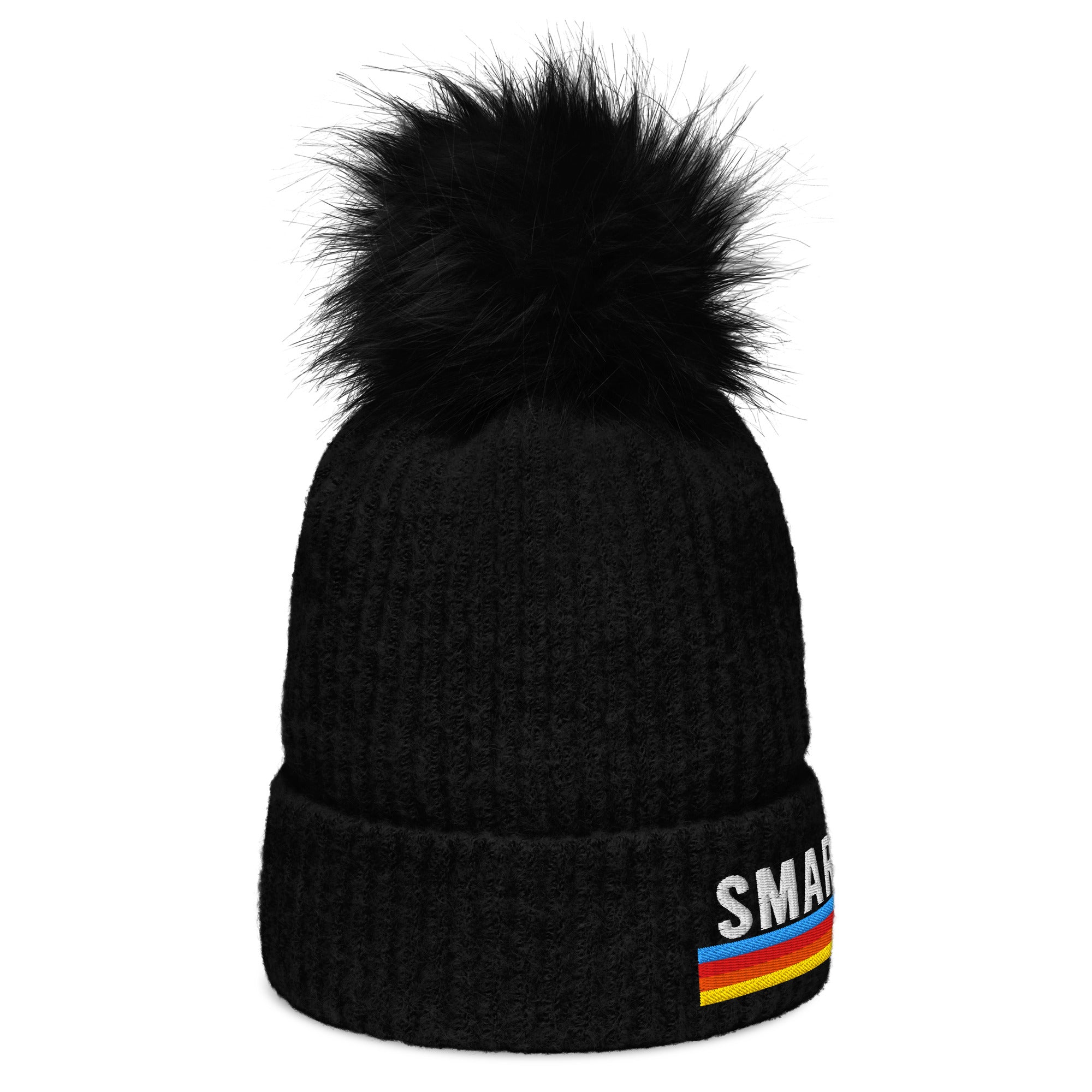 A black knit pom-pom beanie featuring partially visible 'SMARTLESS' embroidery, shown from a slightly angled side view. The multicolored stripe pattern appears below the text, and the beanie has a folded cuff with a fluffy black pom-pom on top.