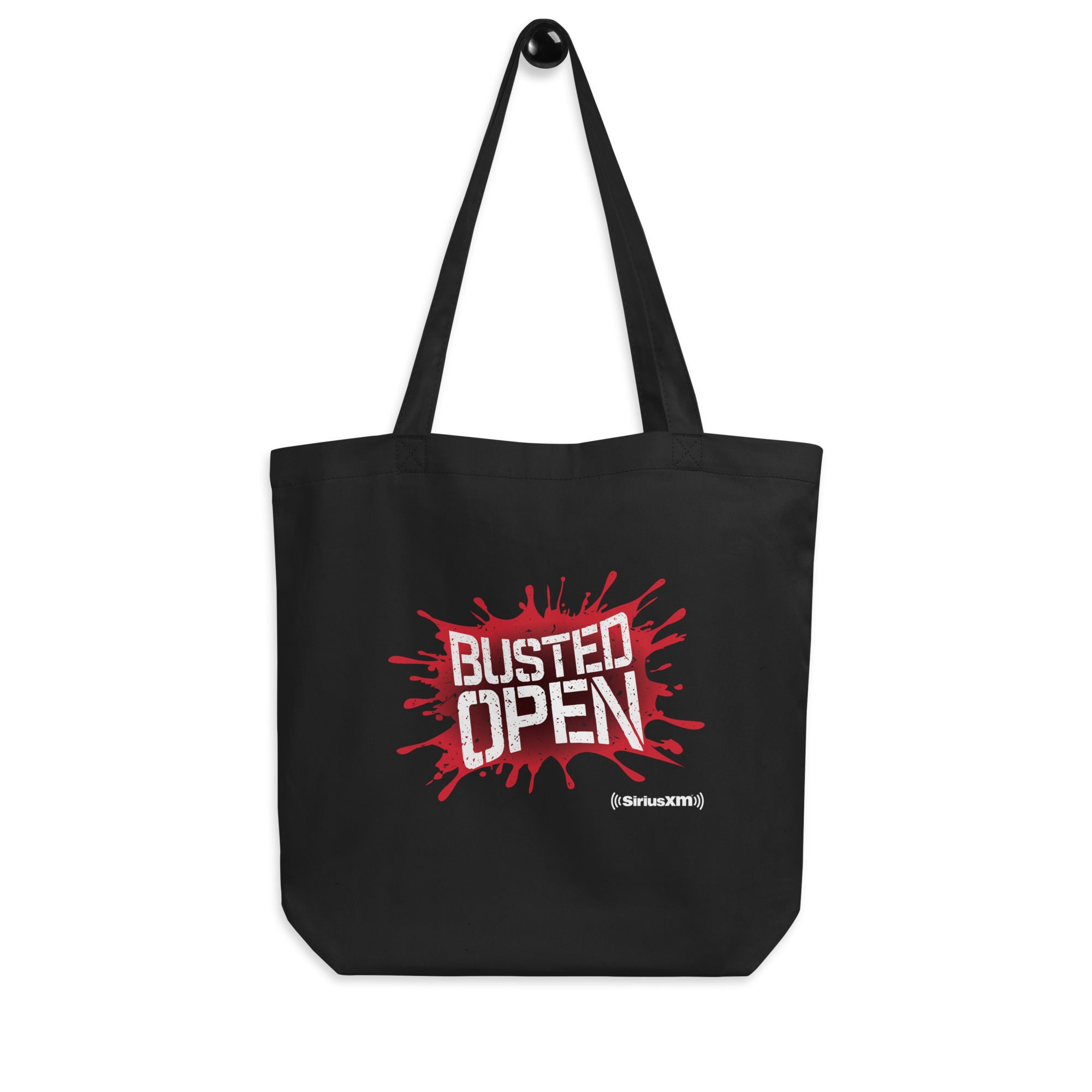 Black tote bag with the text 'BUSTED OPEN' in red, featuring a paint splash design and the 'SiriusXM' logo.