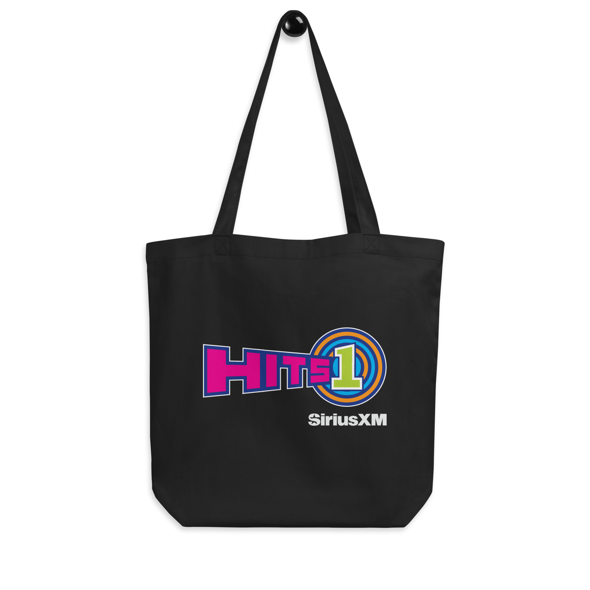 Black tote bag featuring the 'HITS 1' logo in pink, purple, orange and vivid green.  Also, include SiriusXM branding in white underneath.