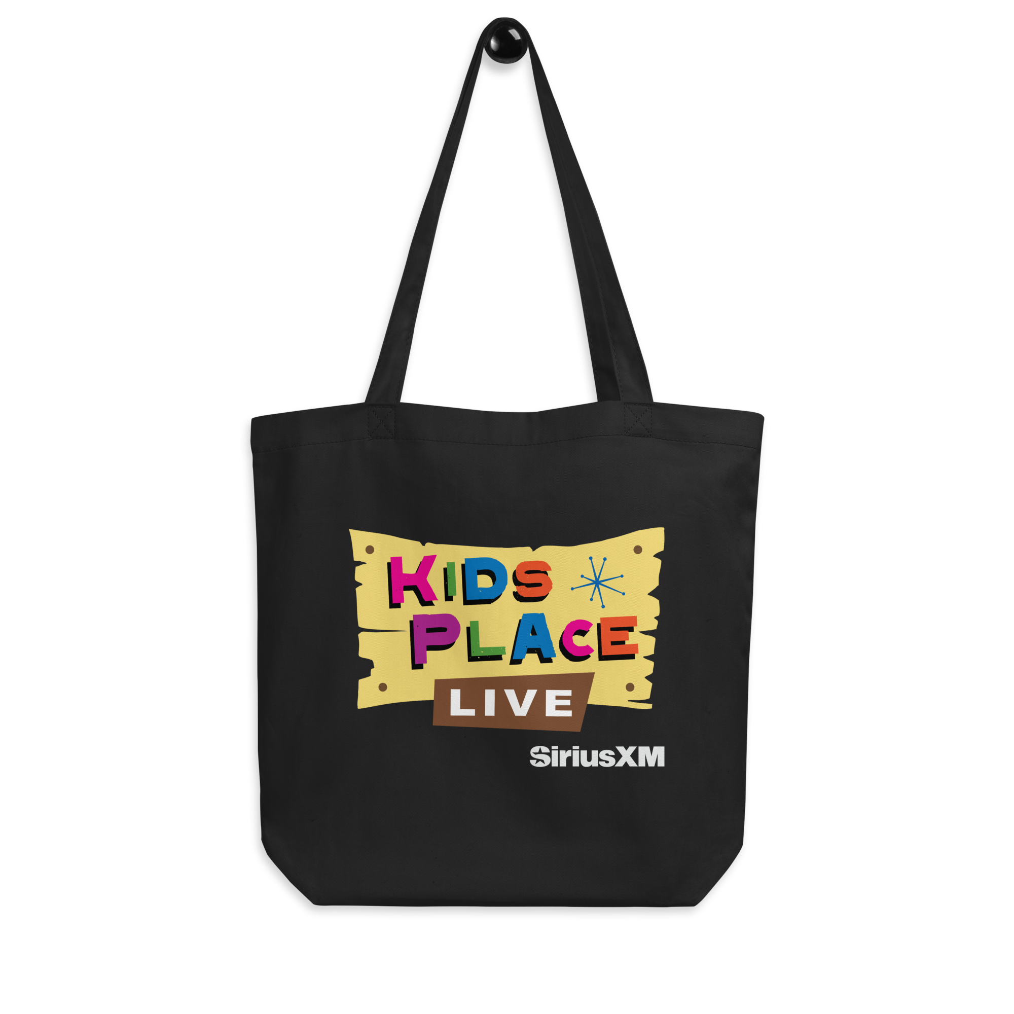 Black tote bag with colorful 'Kids Place Live' with colorful stars and a wooden sign illustration and SiriusXM text on it in white.