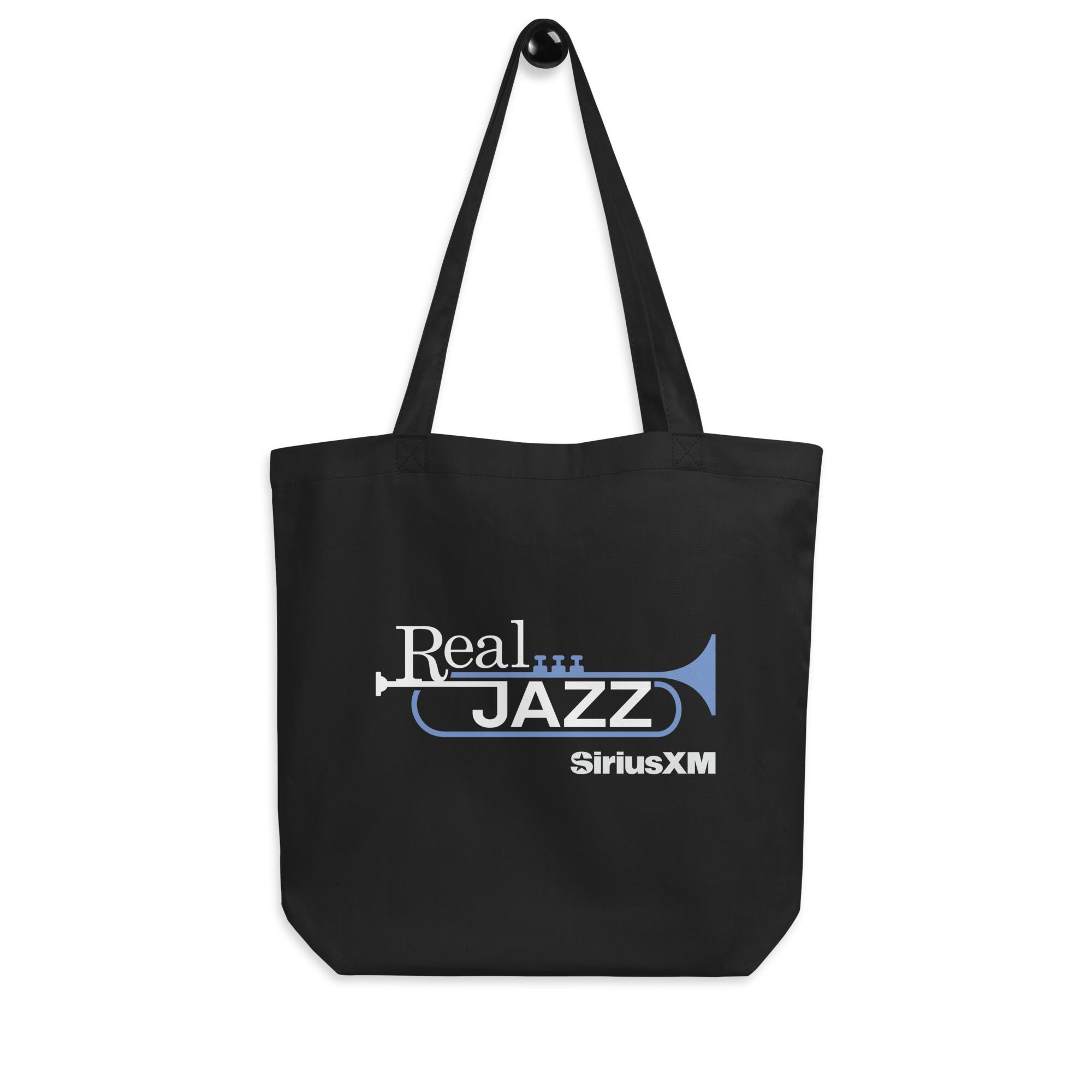 Black tote bag featuring 'Real JAZZ' text in white and light blue and a trumpet graphic, alongside the 'SiriusXM' logo.