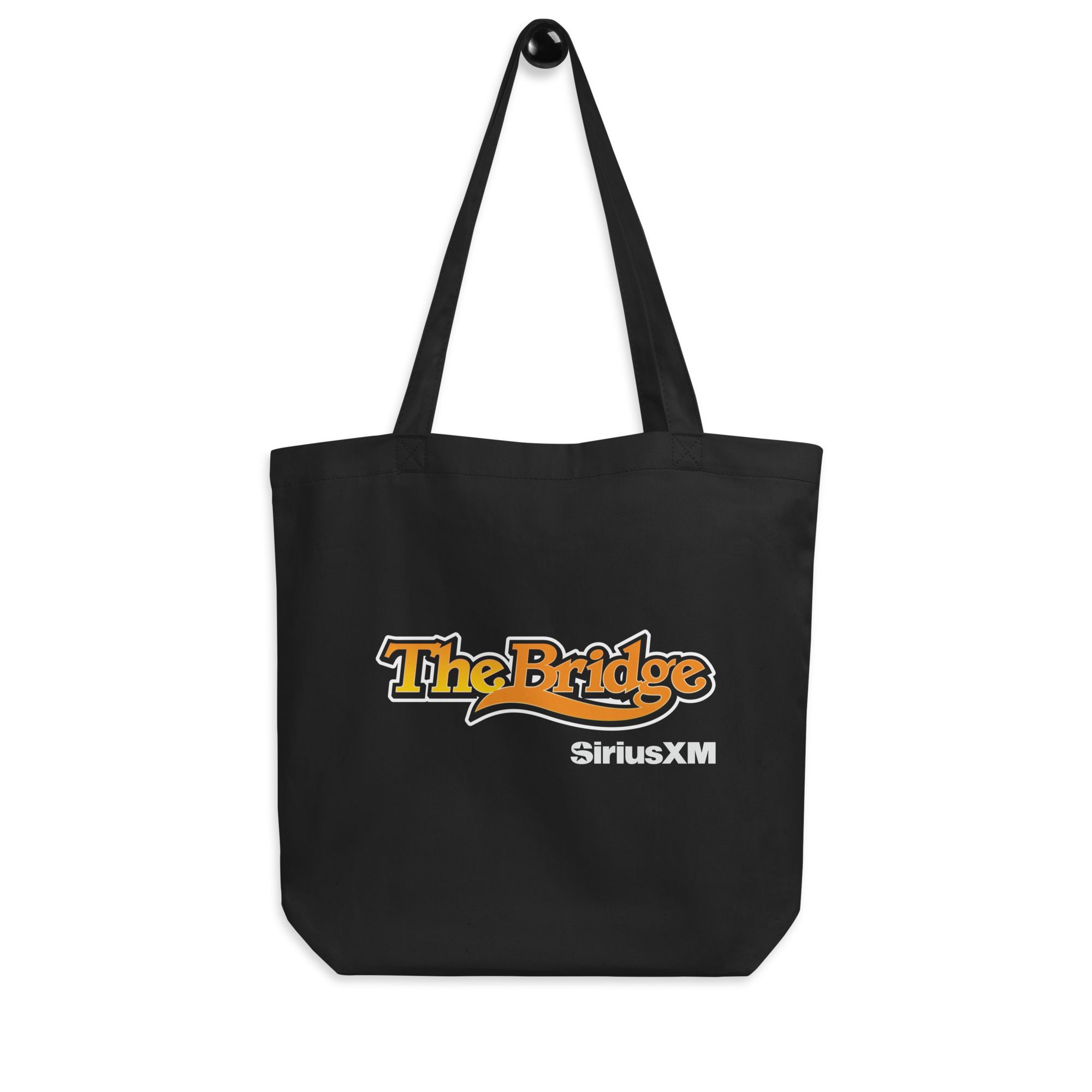 Black tote bag with 'The Bridge' logo in orange and 'SiriusXM' logo in white.