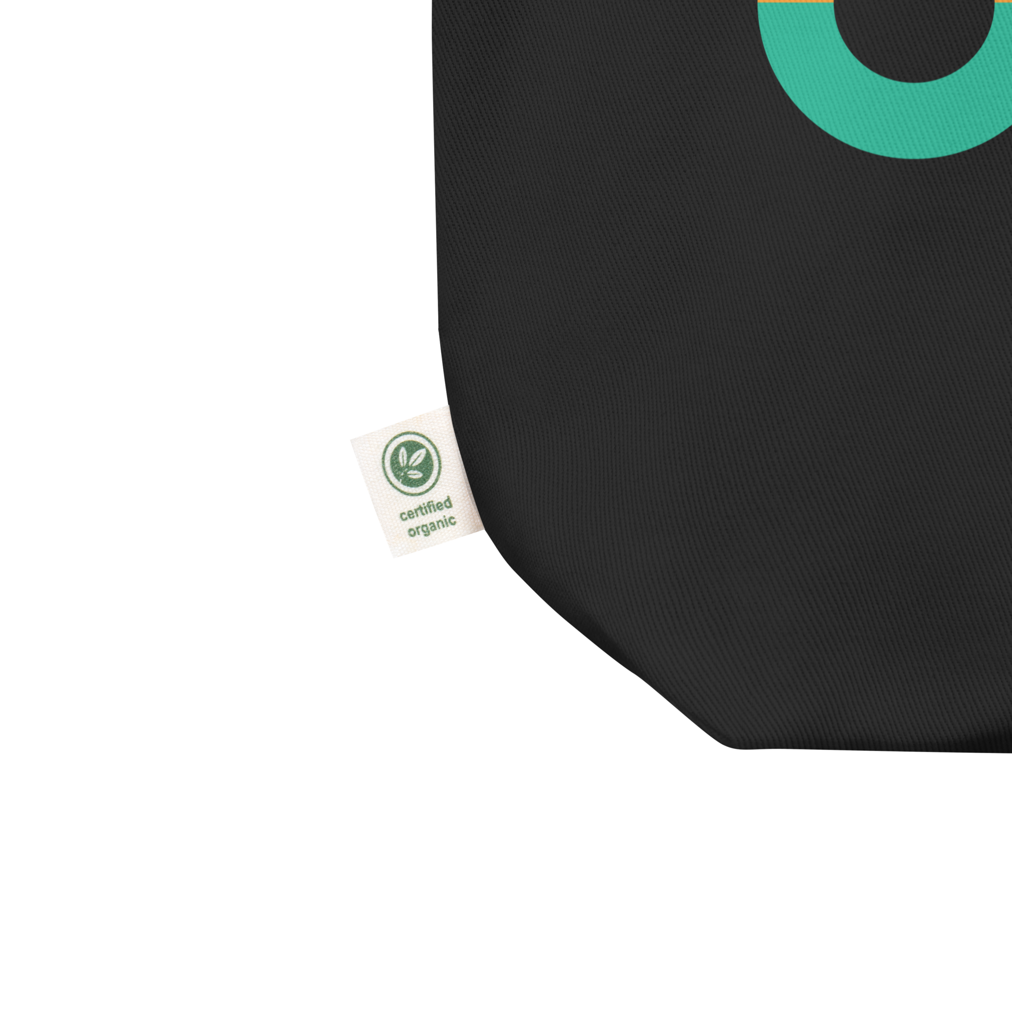 Close up of black tote bag featuring a tag that reads 'certified organic.'