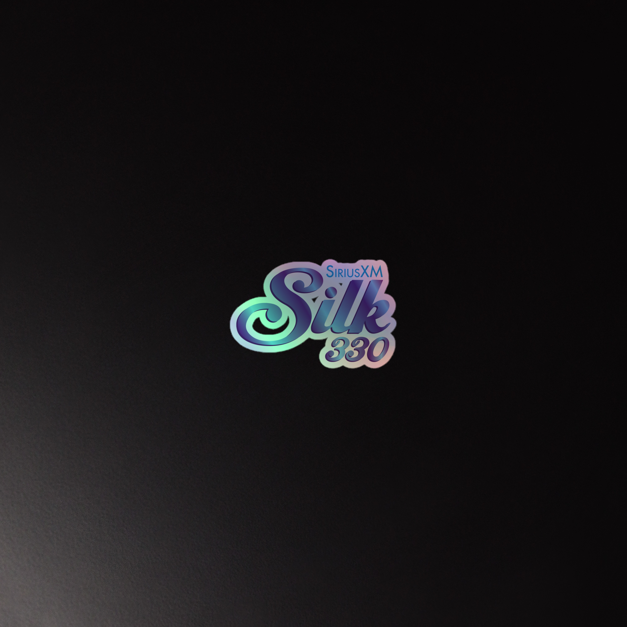 Holographic sticker of the 'SiriusXM Silk 330' logo on a black background, featuring a colorful, glossy design.