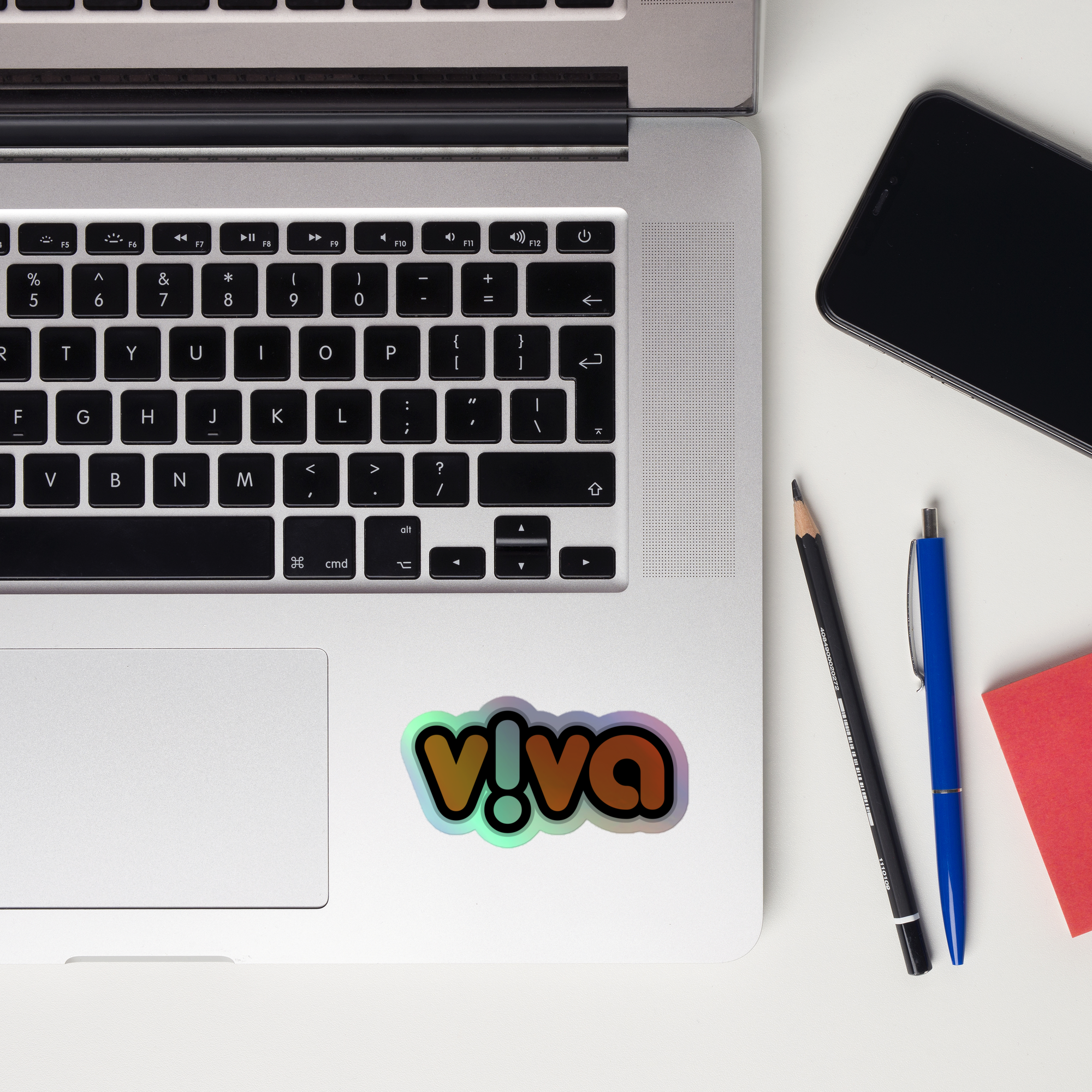 A laptop keyboard displaying the colorful 'v!va' holographic sticker.