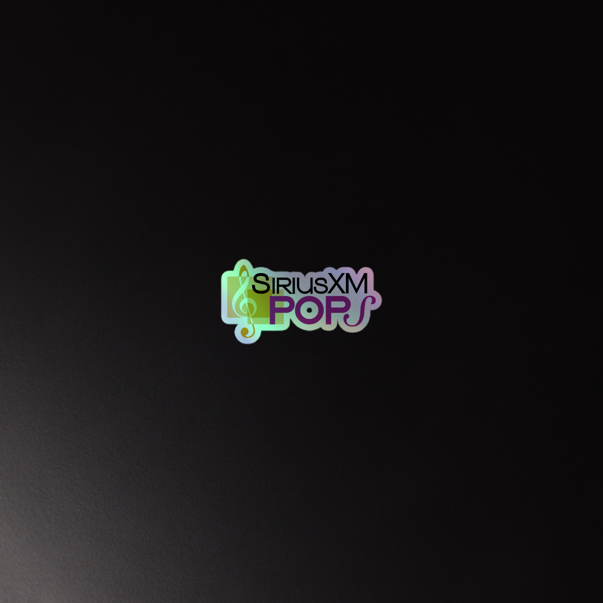 A holographic sticker of the 'SiriusXM Pops' logo on a dark background.