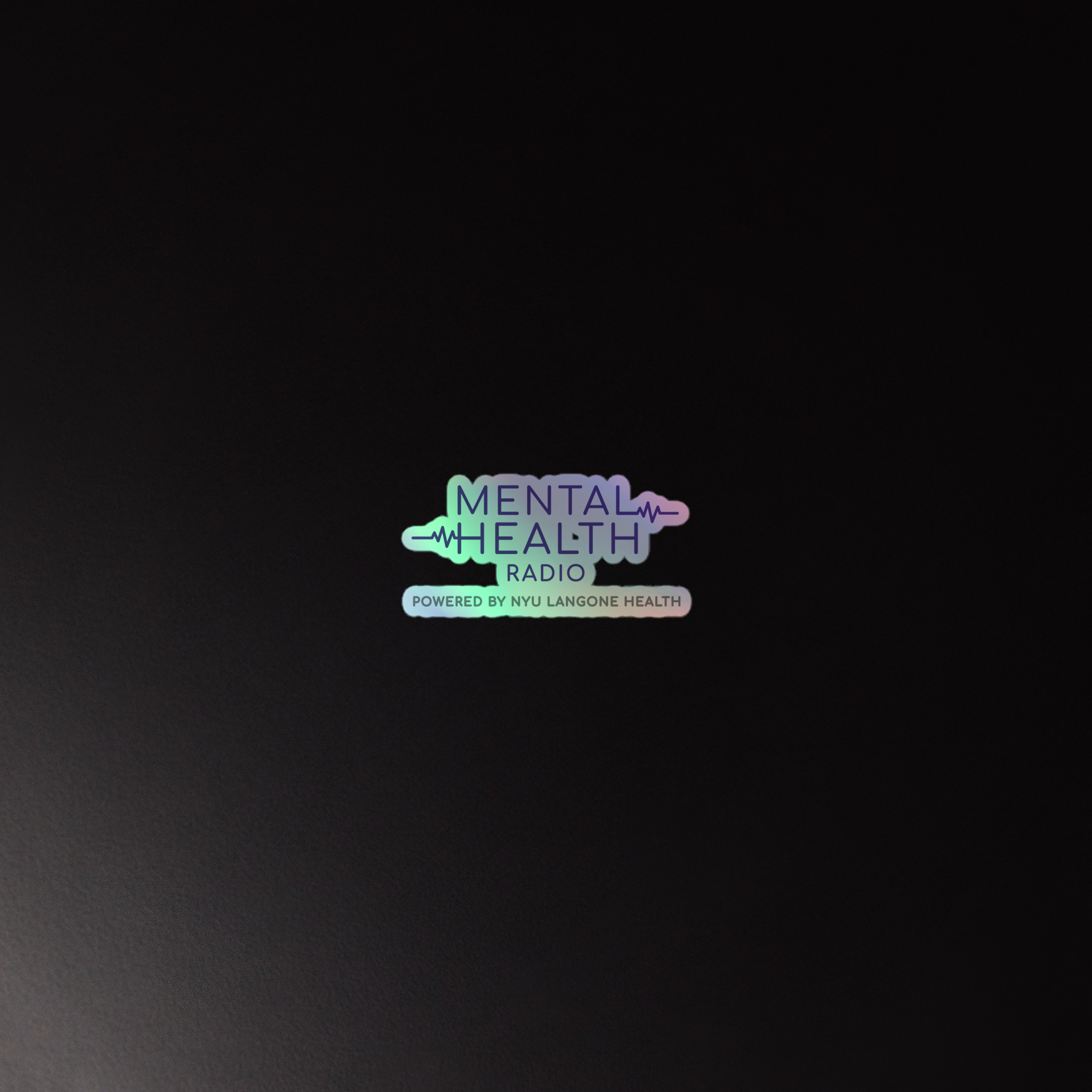 Holographic sticker of the 'Mental Health Radio, powered by NYU Langone Health' logo, displayed on a dark background.