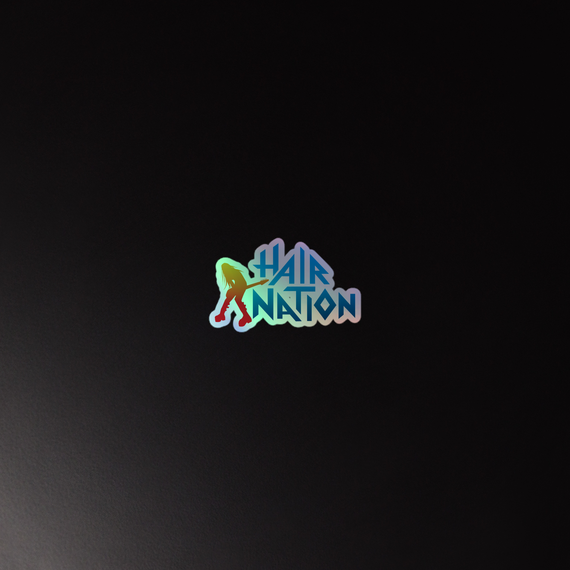 Holographic sticker of colorful 'Hair Nation' logo on a black background.