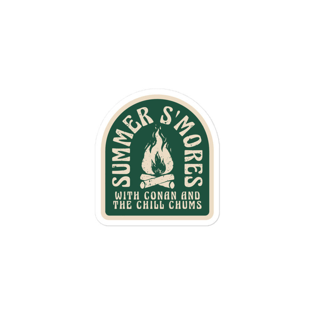 Logo design featuring the text 'SUMMER S'MORES' above a fire and the subtitle 'WITH CONAN AND THE CHILL CHUMS' on a green background.