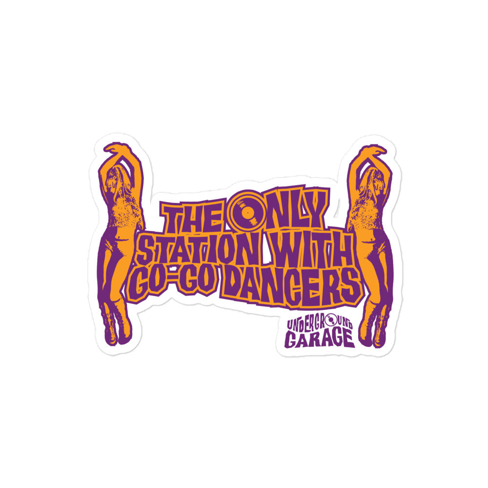 Sticker design featuring the text 'THE ONLY STATION WITH GO-GO DANCERS' in bold purple and orange letters, accompanied by two silhouetted figures in dance poses. Below the main text, it includes the words 'UNDERGROUND GARAGE.'