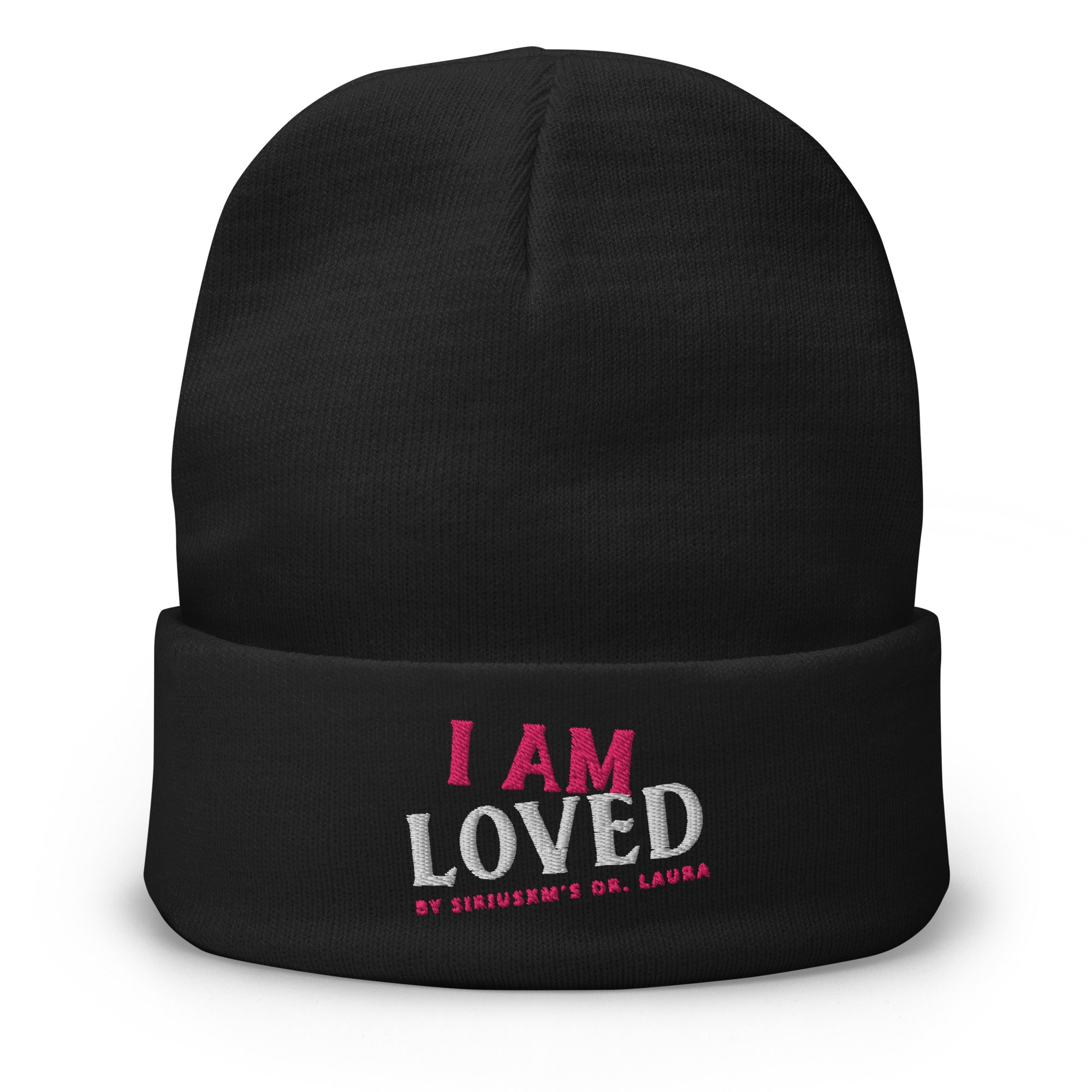 A black knit beanie with an embroidered text reading 'I AM LOVED,' with 'I AM' in pink and 'LOVED' in white lettering. Below, it says 'BY SIRIUSXM'S DR. LAURA' in smaller pink text. The beanie has a folded cuff, providing a classic and stylish look.