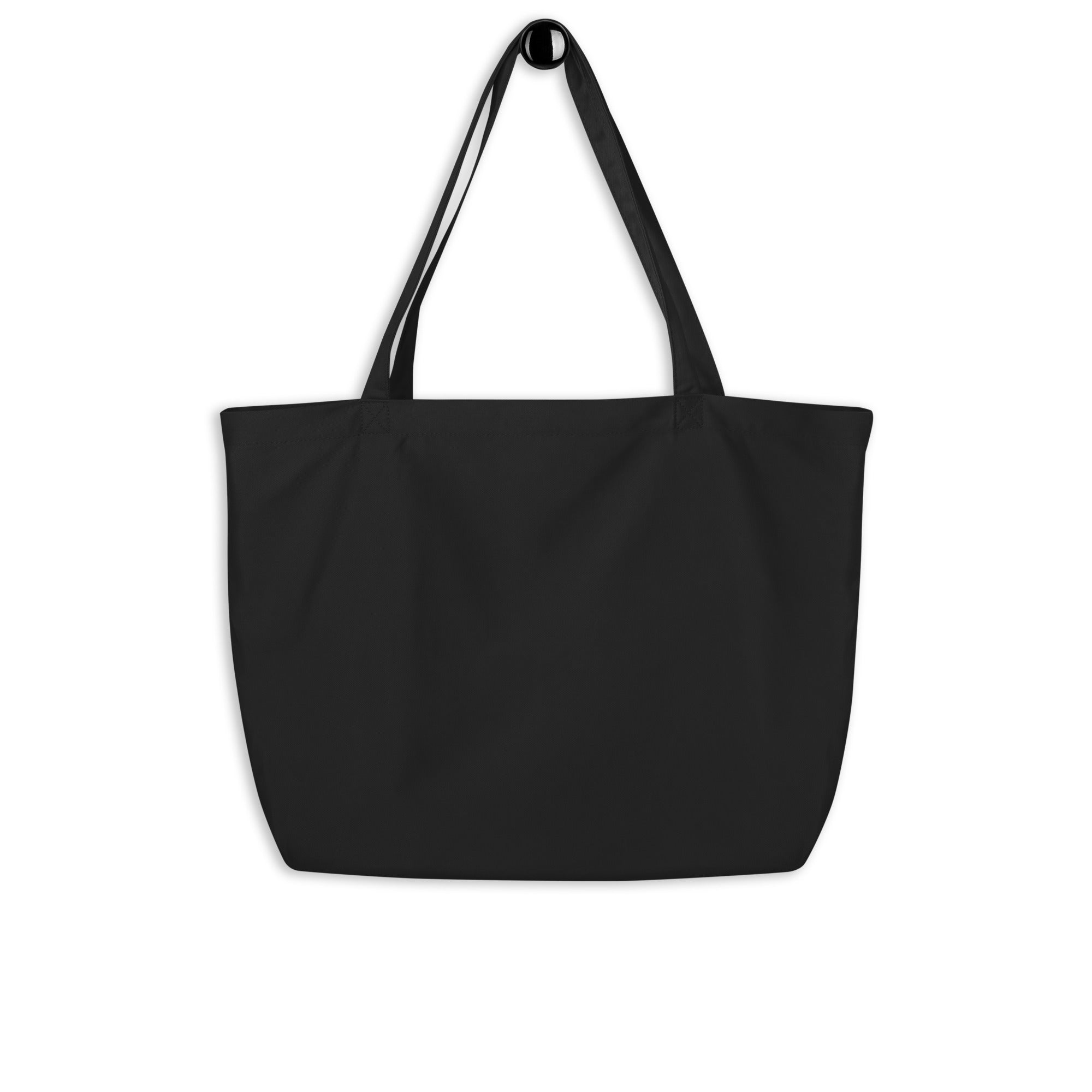 The backside of the black tote bag, shown without any visible designs or text. The fabric appears smooth, and the straps are long for carrying over the shoulder.