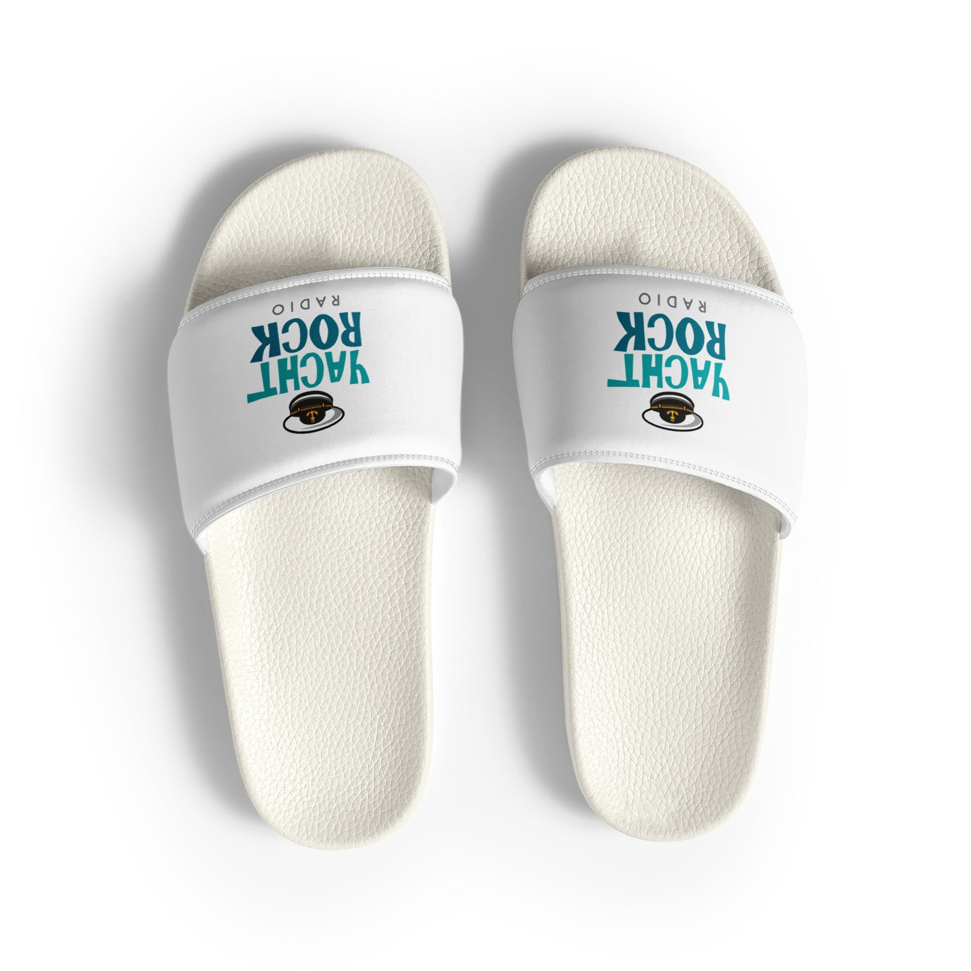 White slide sandals with 'Yacht Rock Radio' logo in teal with captain's hat graphic.