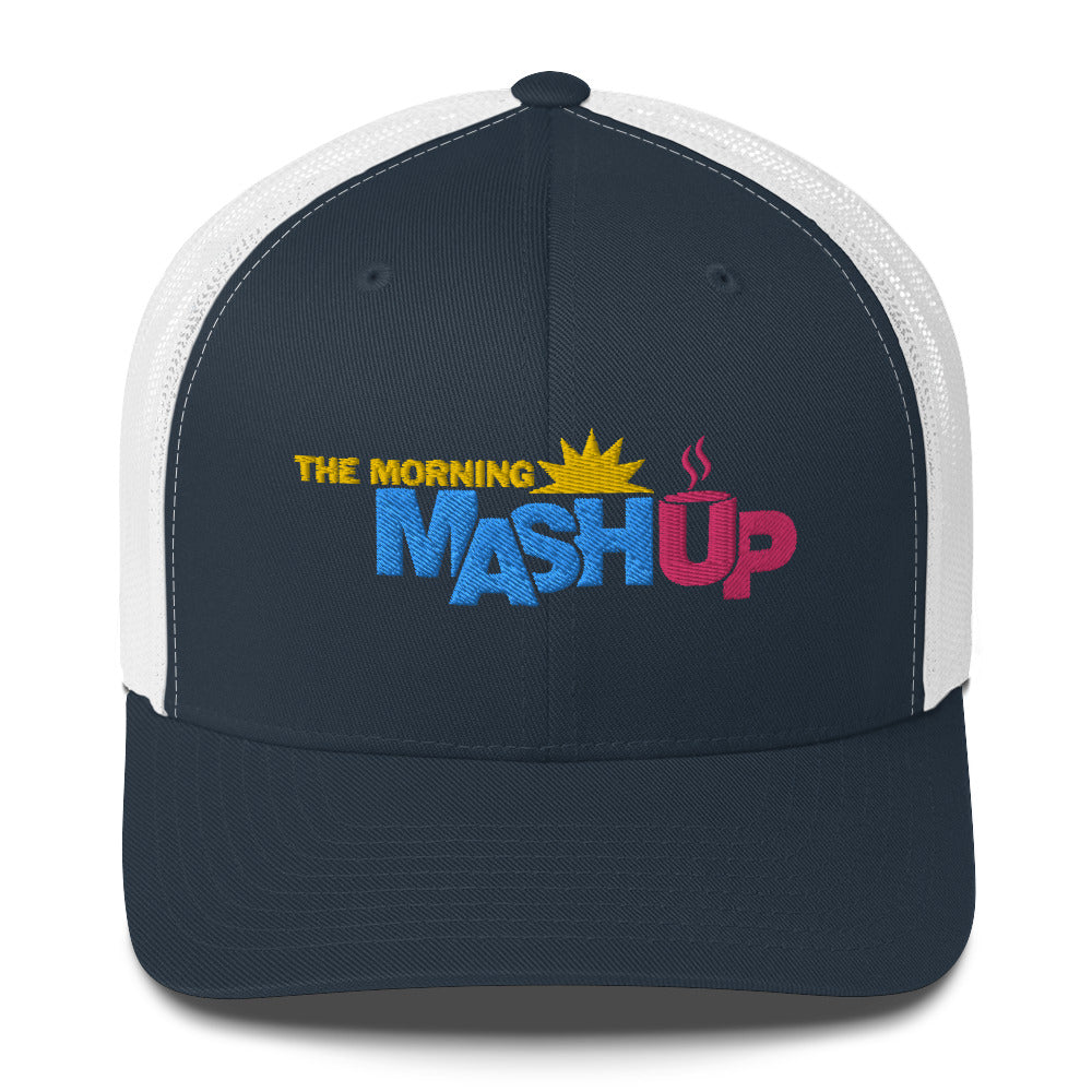 A black and white trucker hat featuring the logo 'THE MORNING MASH Up' with colorful blue, pink and yellow text including a sun and a coffee cup.