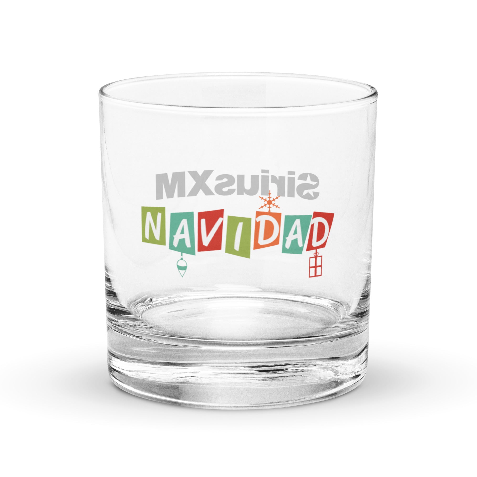 One side of rocks glass with a colorful Navidad logo in the center.