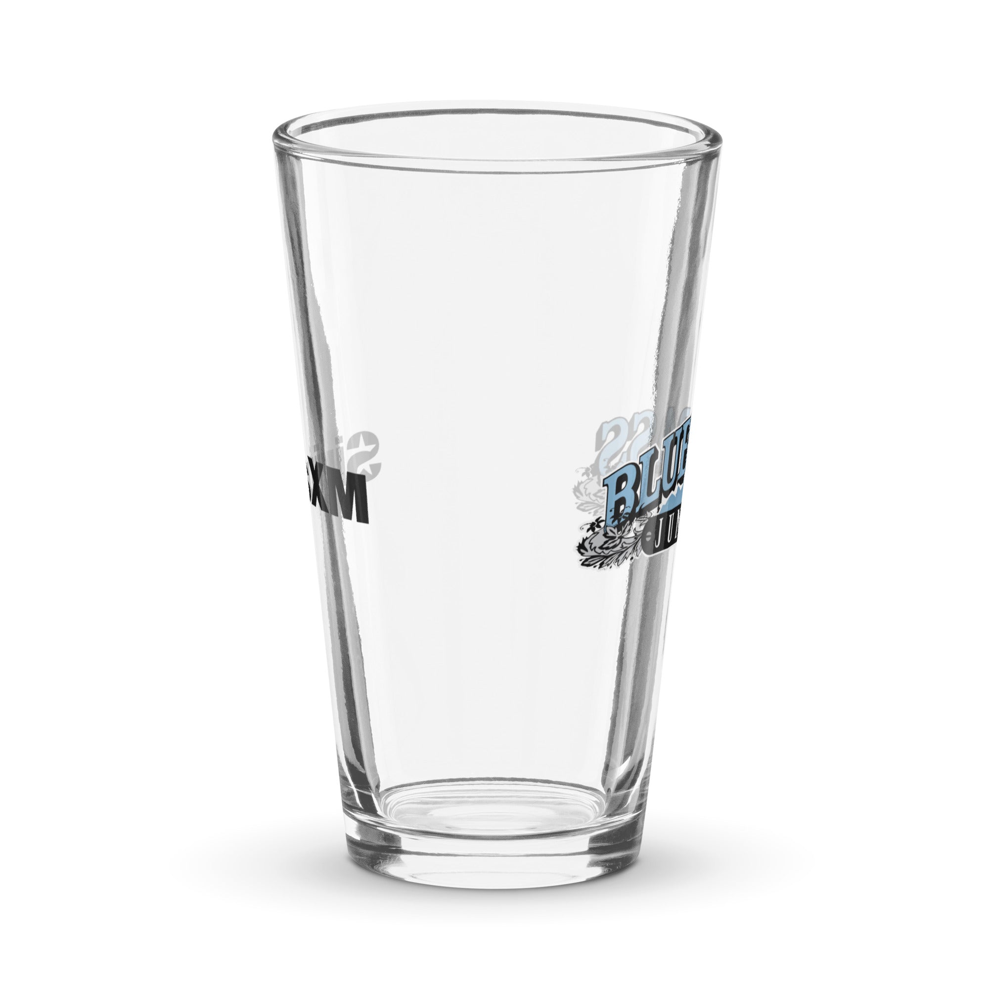 Side view of clear pint glass featuring partially visible front and back designs.