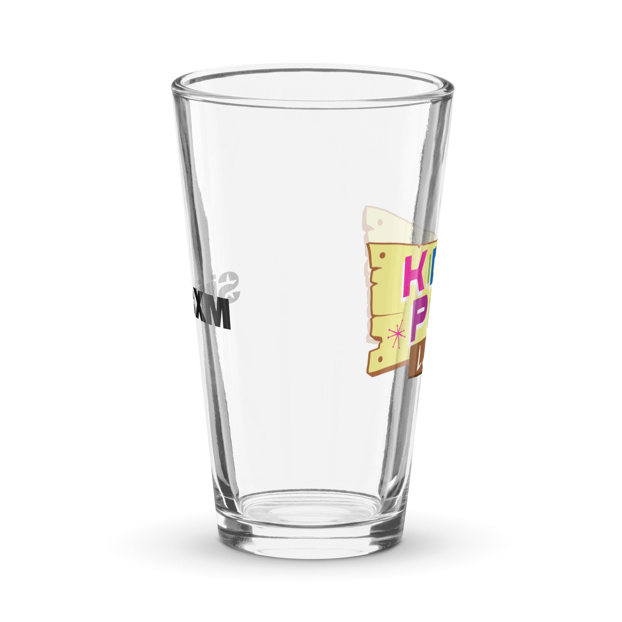 Side view of clear pint glass featuring partially visible front and back designs.