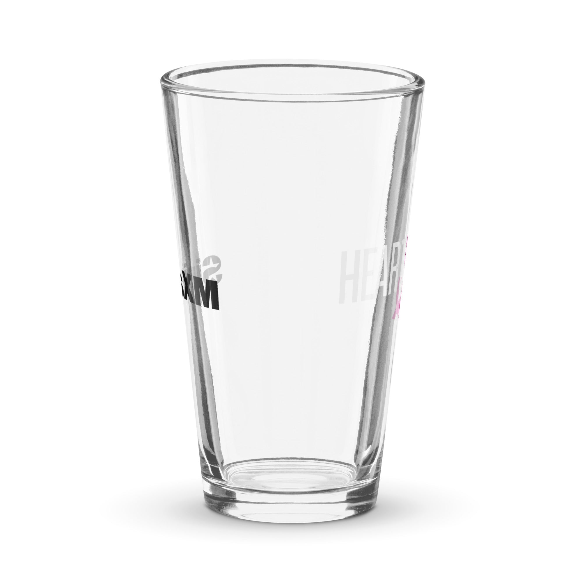 Side view of clear pint glass featuring partially visible front and back designs.