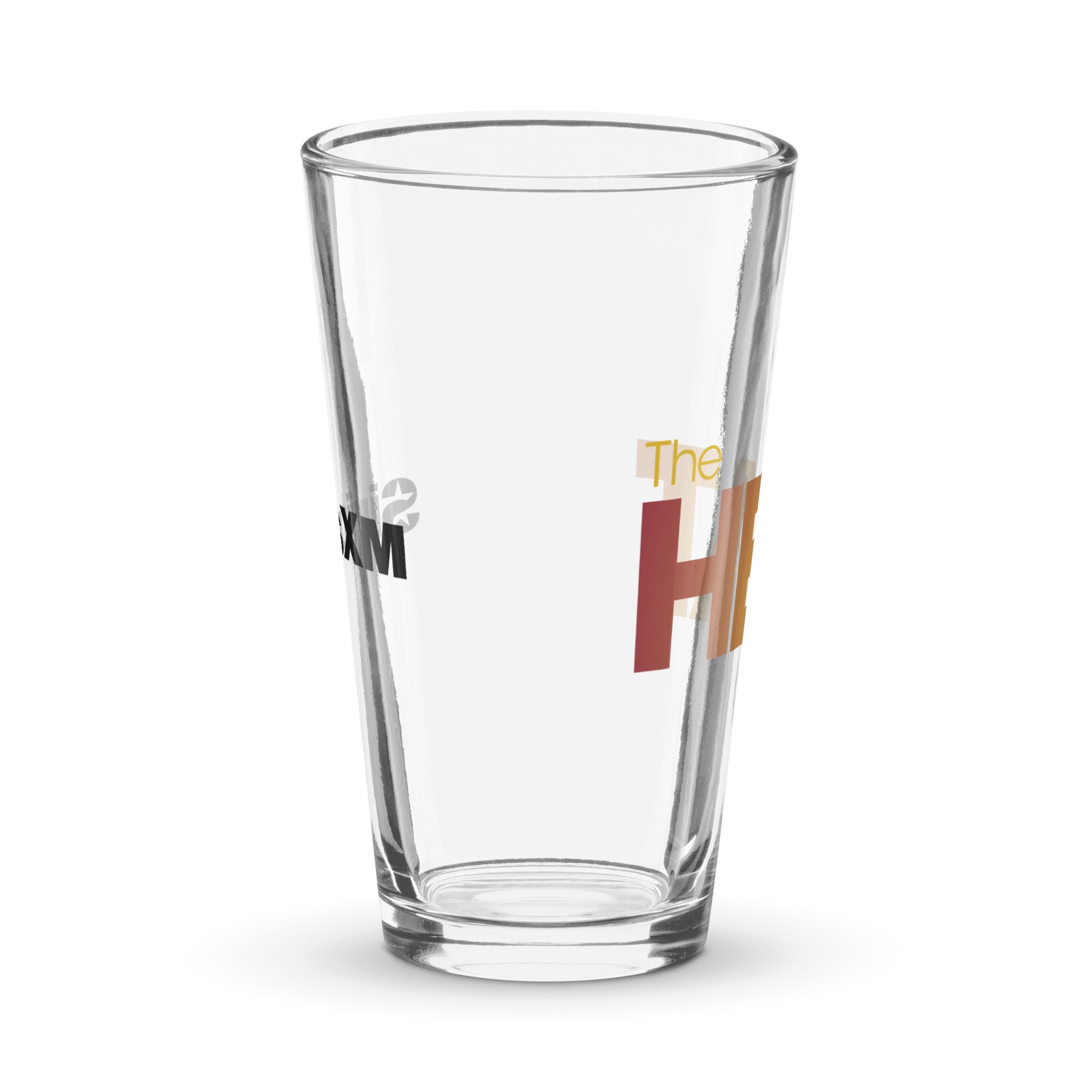 Side view of clear pint glass featuring partially visible front and back designs.