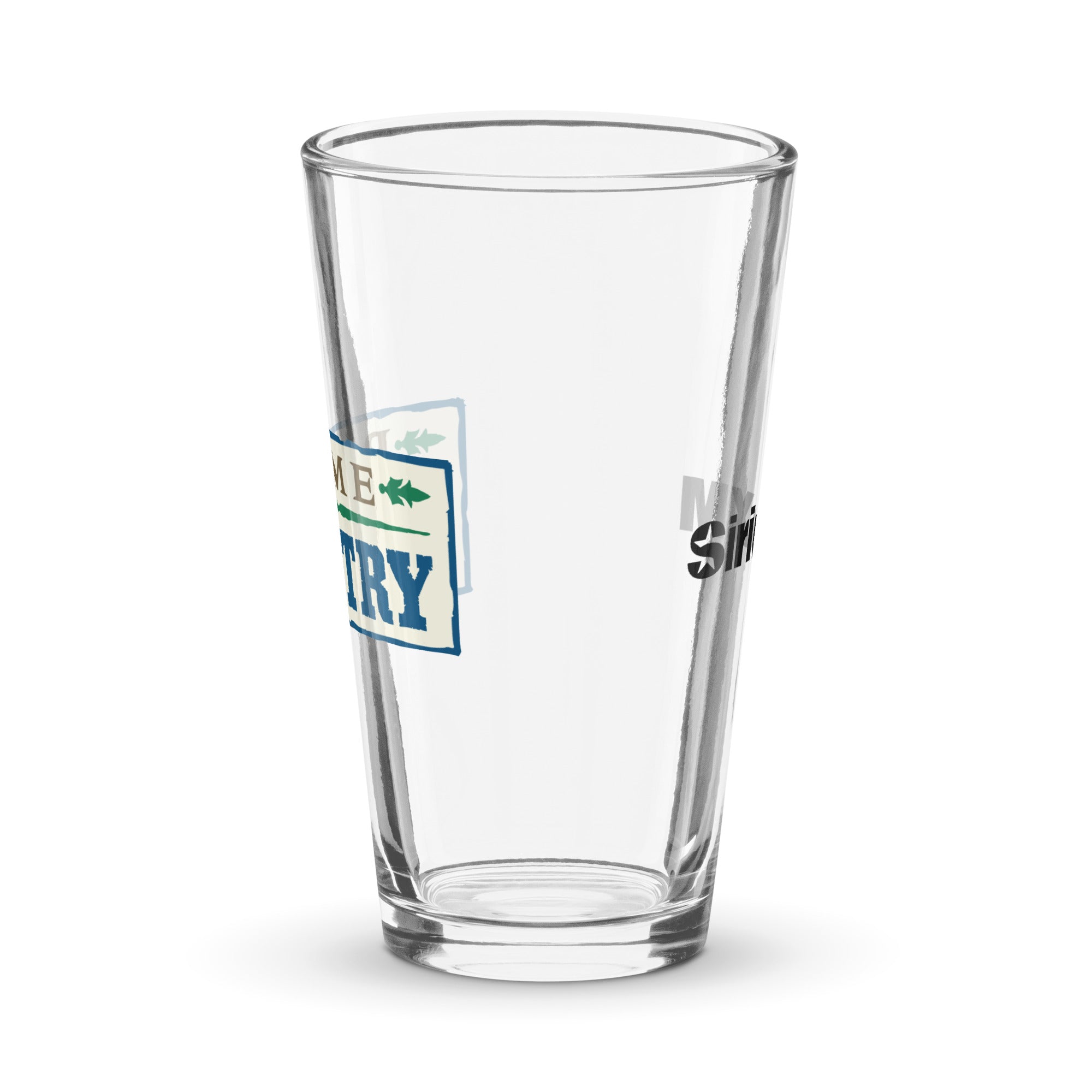 Side view of clear pint glass featuring partially visible front and back designs.