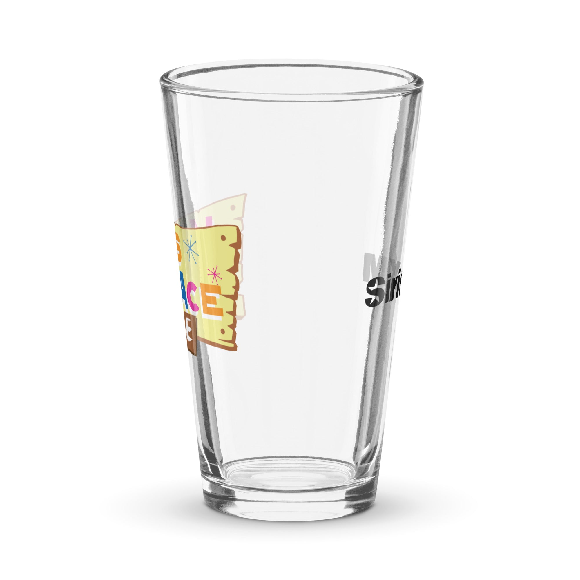 Side view of clear pint glass featuring partially visible front and back designs.