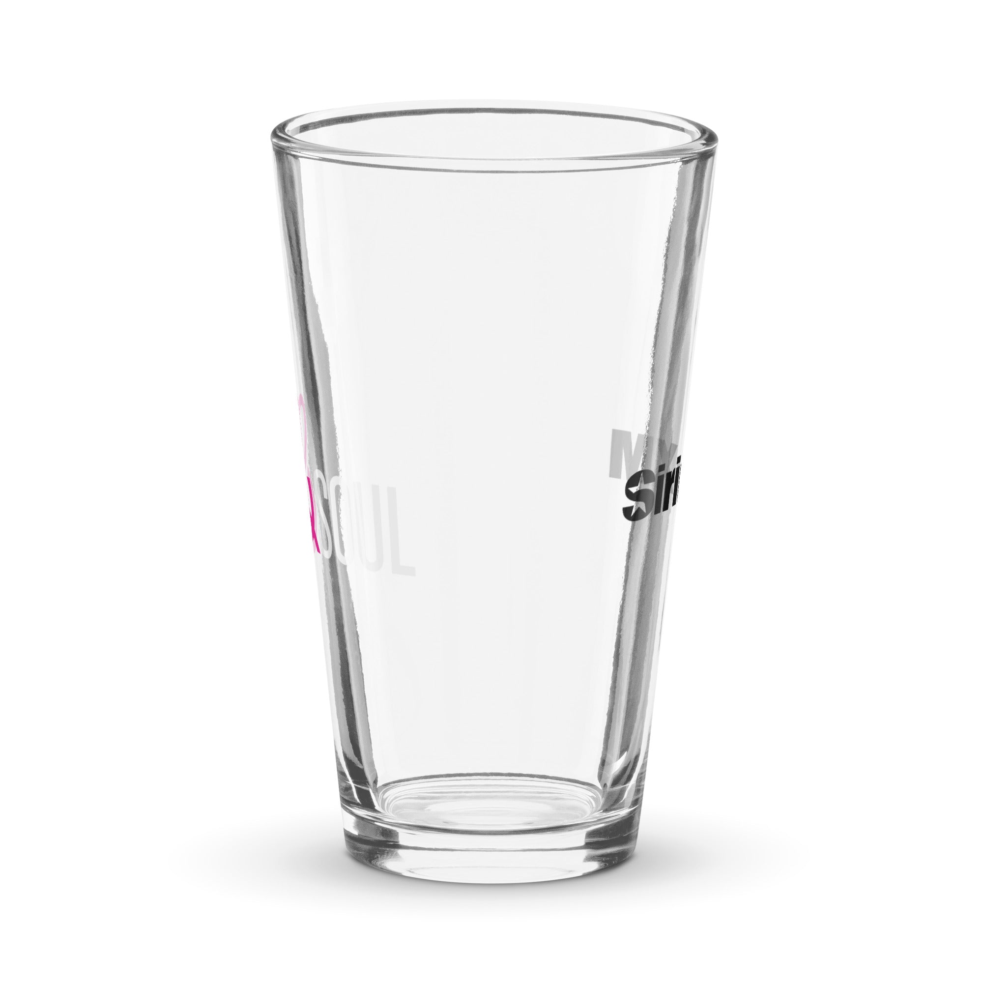 Side view of clear pint glass featuring partially visible front and back designs.