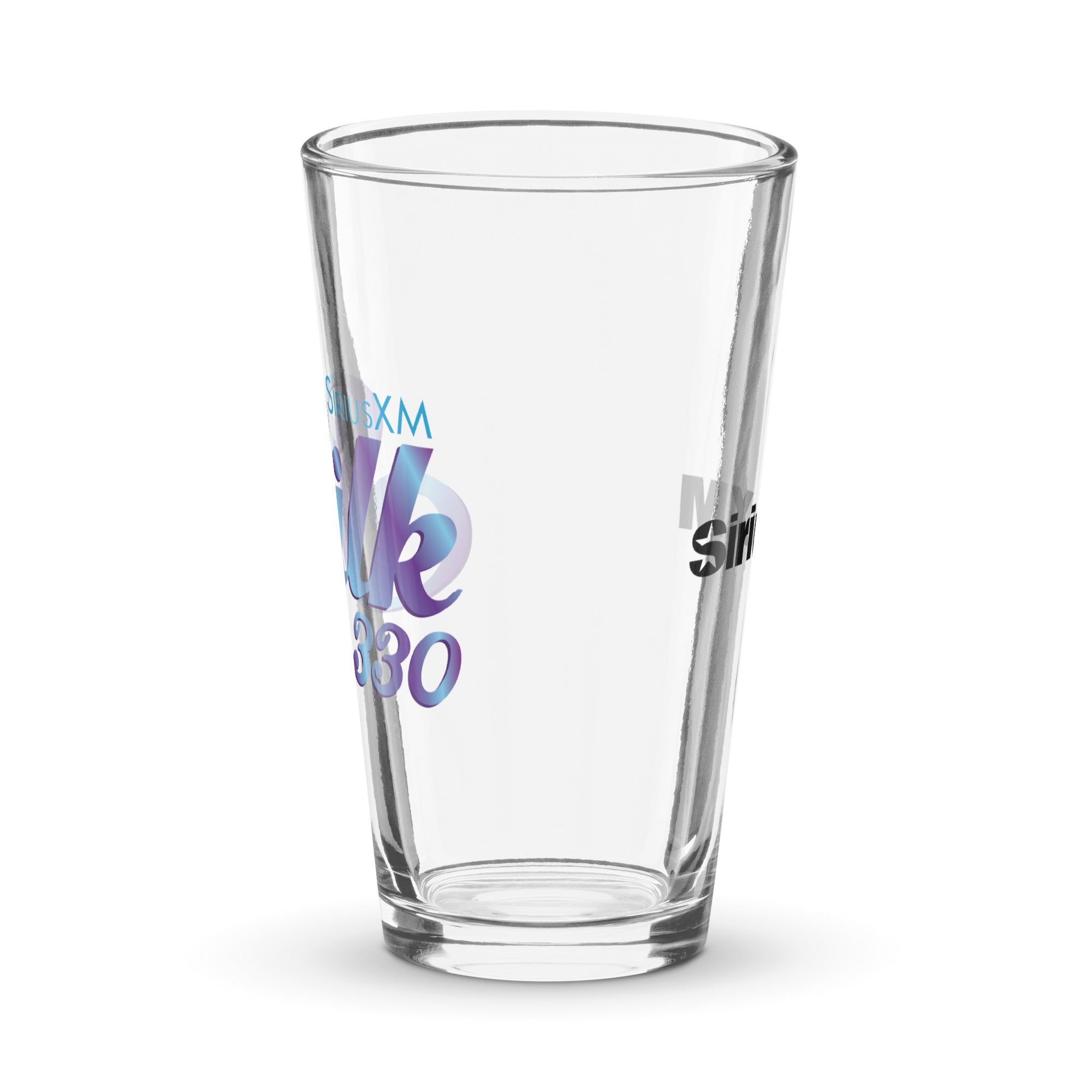 Side view of clear pint glass featuring partially visible front and back designs.