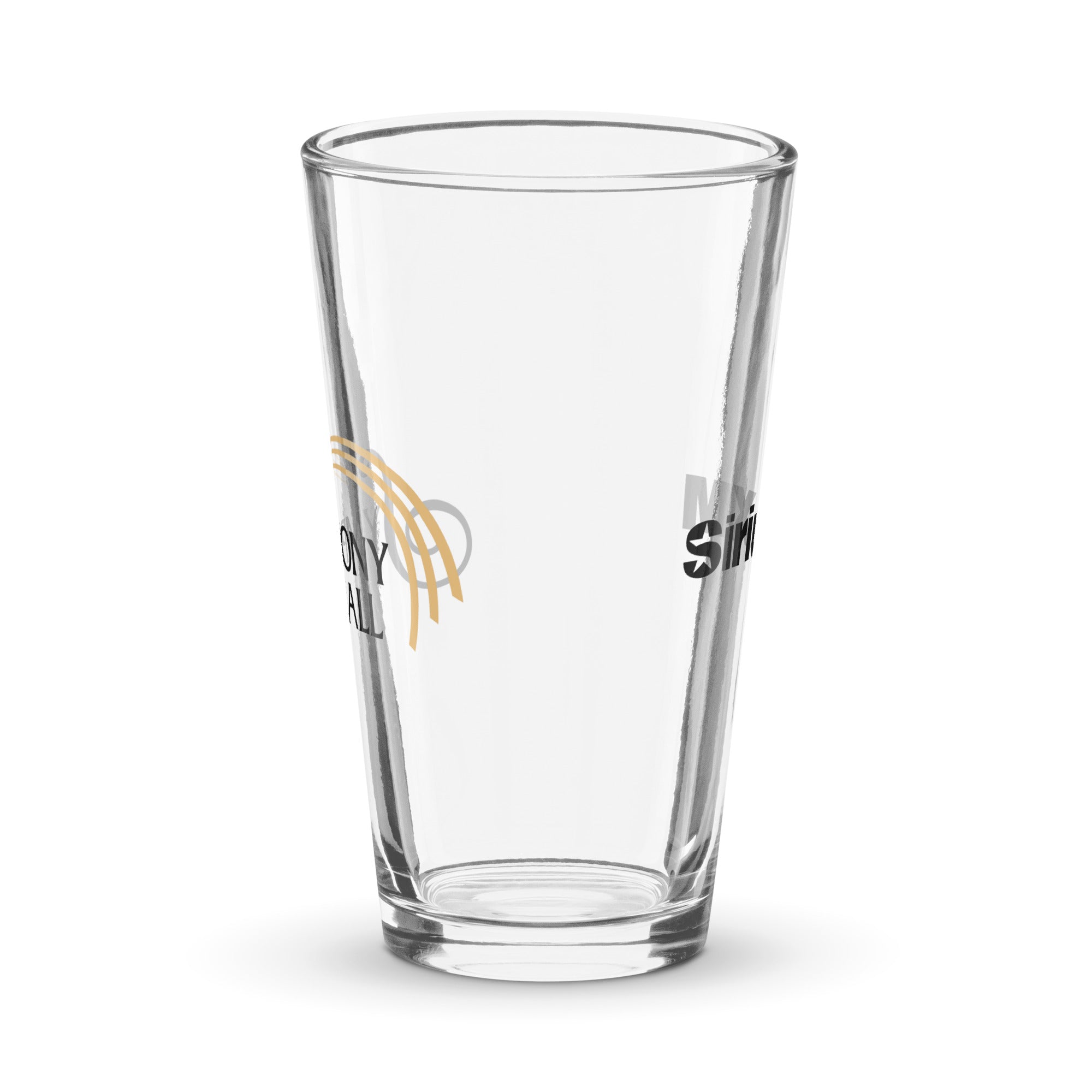 Side view of clear pint glass featuring partially visible front and back designs.