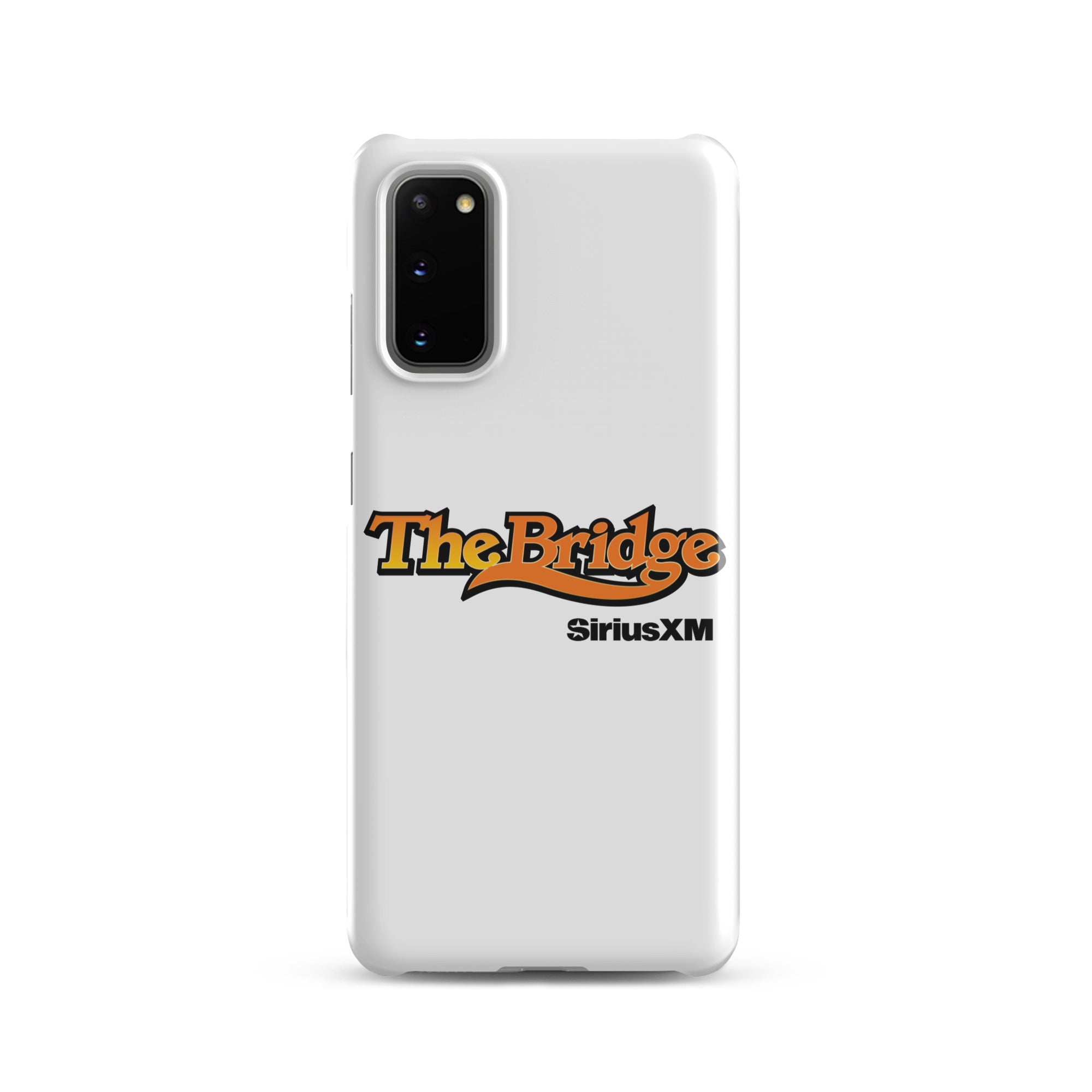 A white phone case featuring the logo 'The Bridge' in an orange gradient and black outline, and  'SiriusXM' in black.