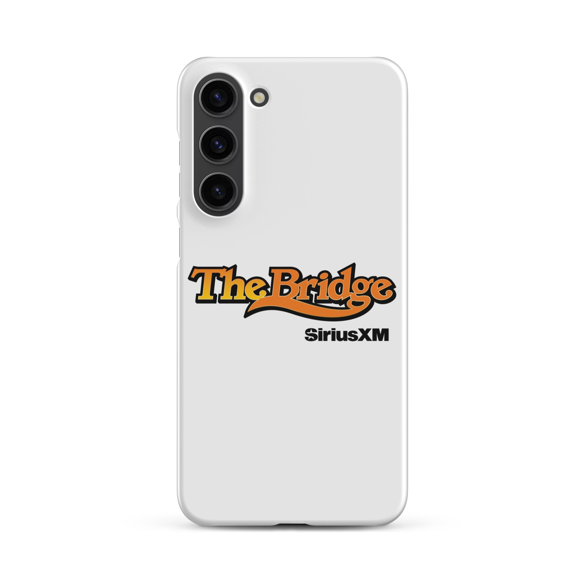 A white phone case featuring the logo 'The Bridge' in an orange gradient and black outline, and  'SiriusXM' in black.