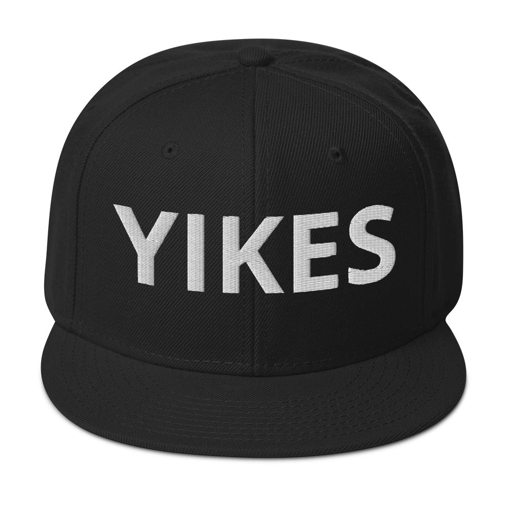 Front of black hat with the word 'YIKES' in light gray letters.