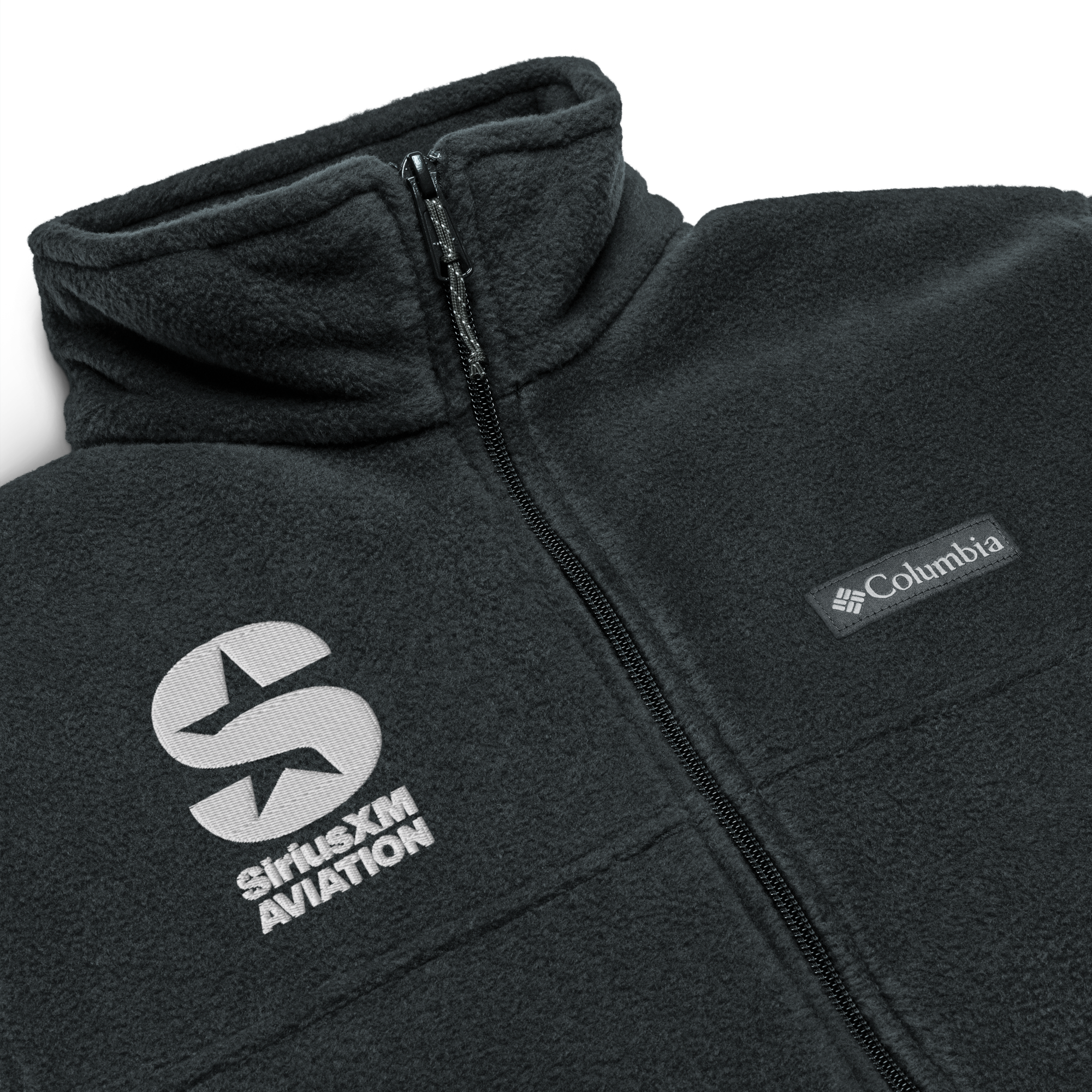 Close up of fleece jacket featuring SiriusXM Aviation logo and Columbia brand tag.