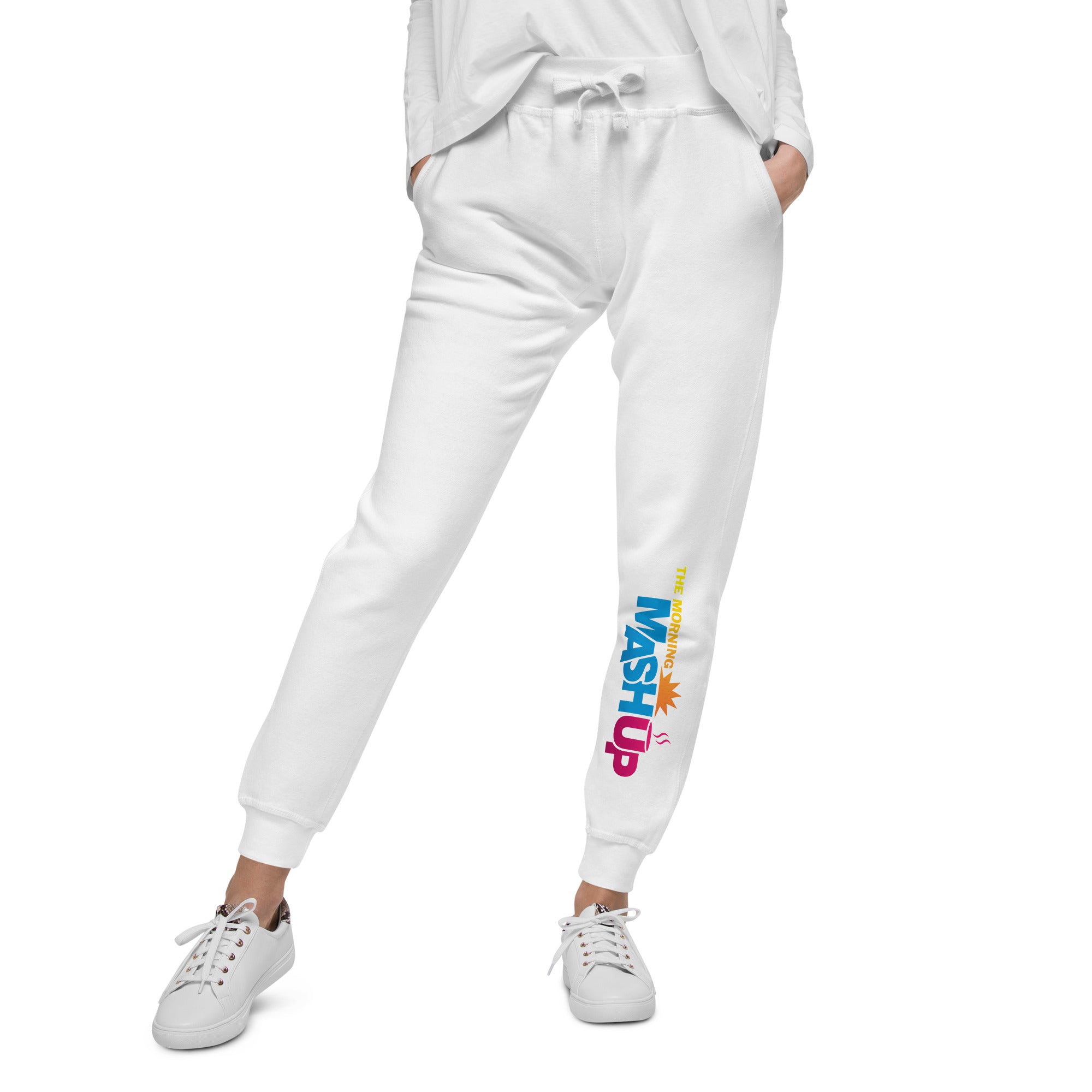 White sweatpants with multi-colored 'THE MORNING MASHUP' logo on the left pant leg.