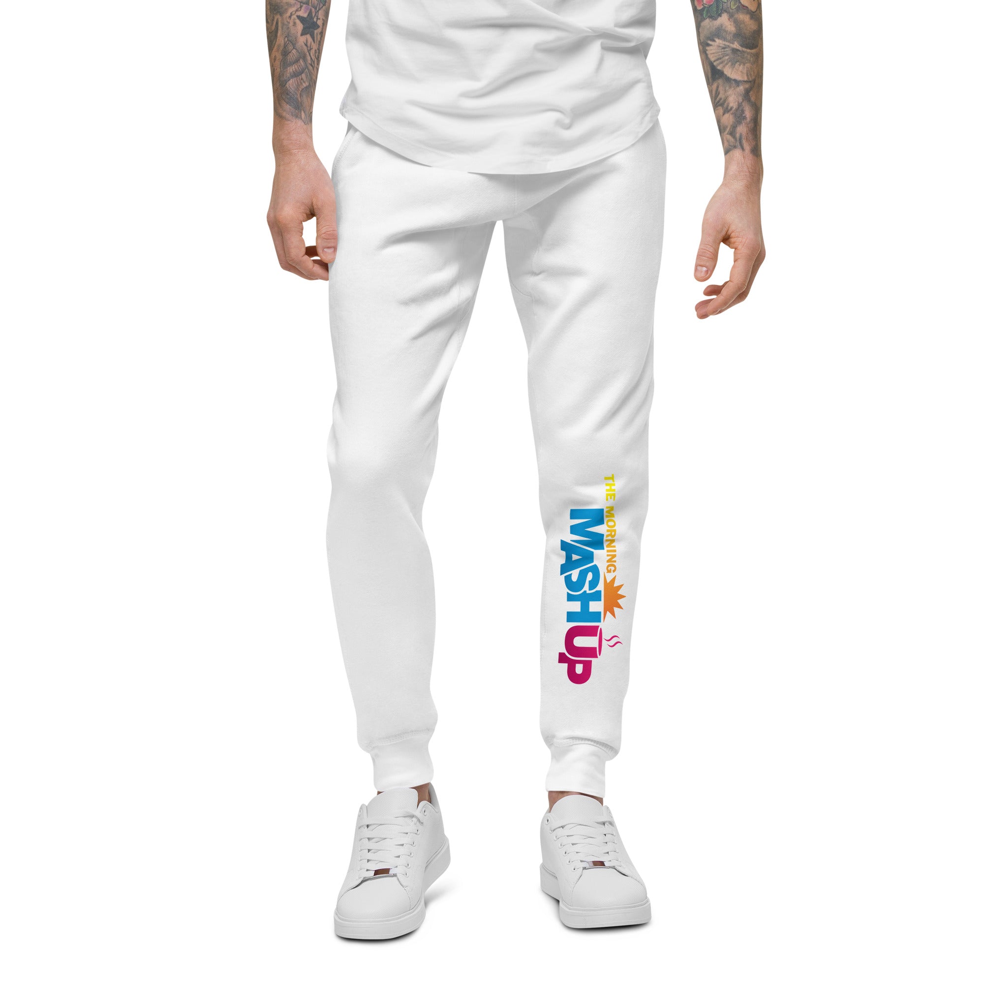 White sweatpants with multi-colored 'THE MORNING MASHUP' logo on the left pant leg.