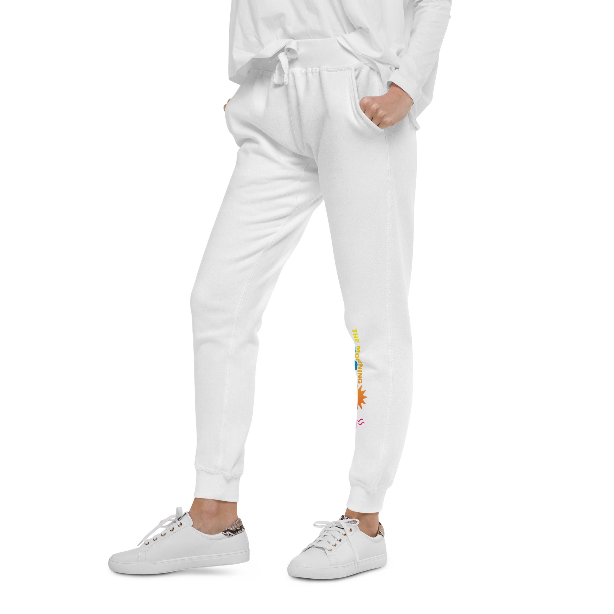 White sweatpants with multi-colored 'THE MORNING MASHUP' logo on the left pant leg.