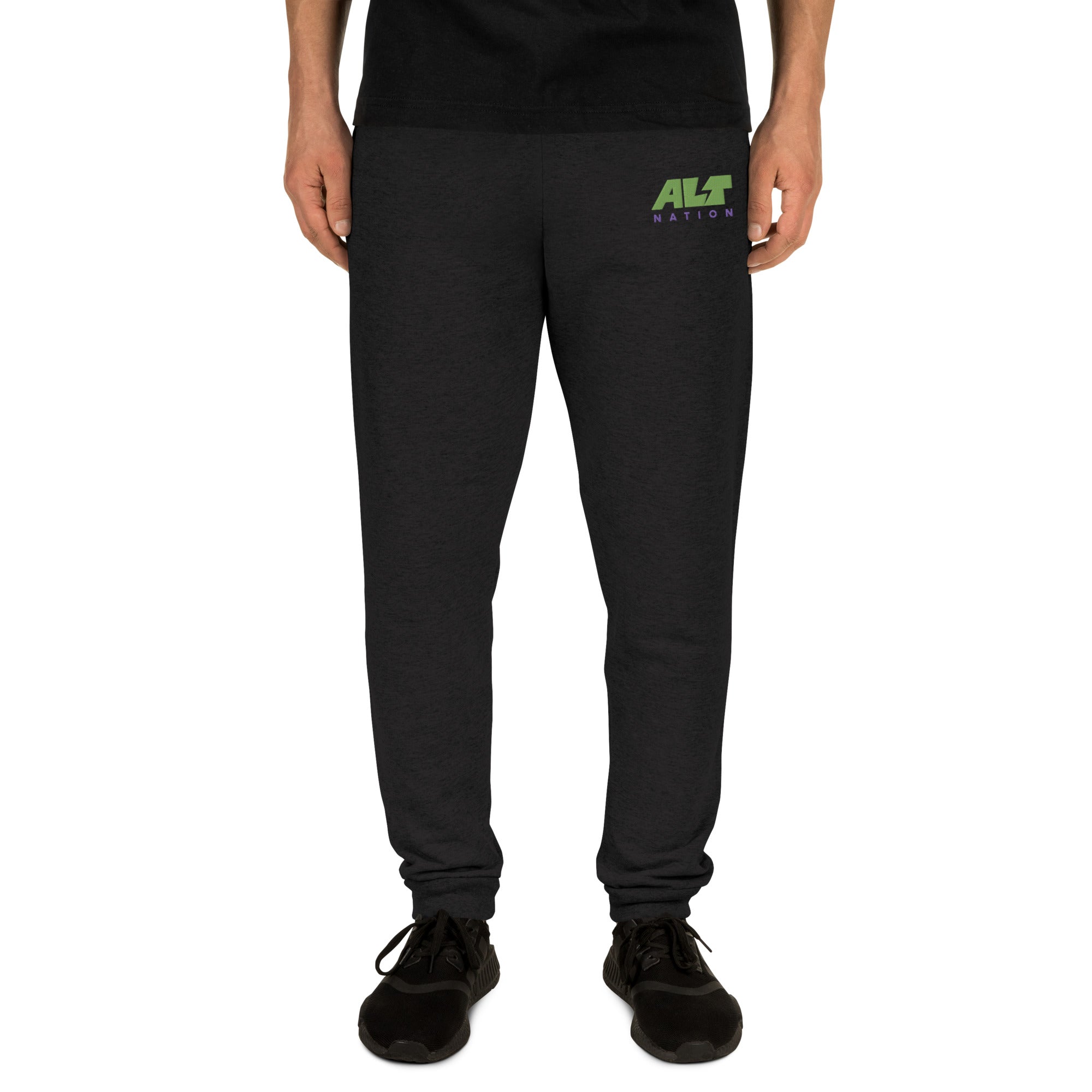 Black jogger pants with 'ALT Nation' logo embroidered in green and blue on the left thigh, on model