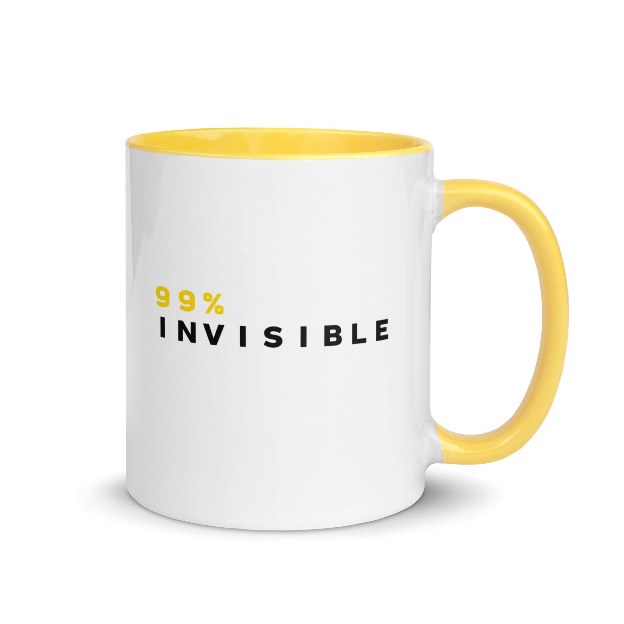 Mug with a white body and yellow interior and handle featuring the text '99% INVISIBLE' in black and yellow lettering.