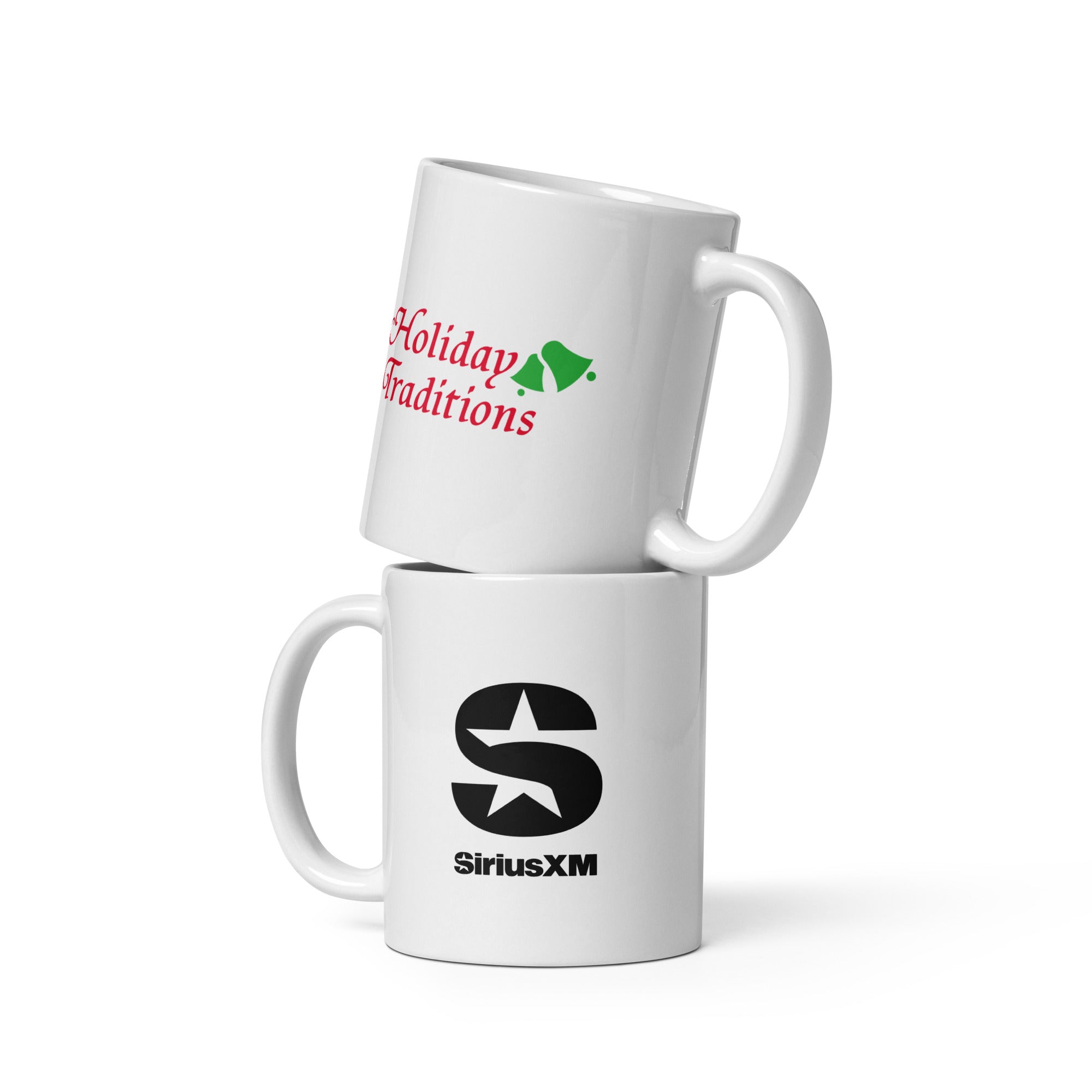 Two stacked white mugs showing opposite sides, one with 'Holiday Traditions' logo in red text and green bells, and the other featuring the SiriusXM logo in black.