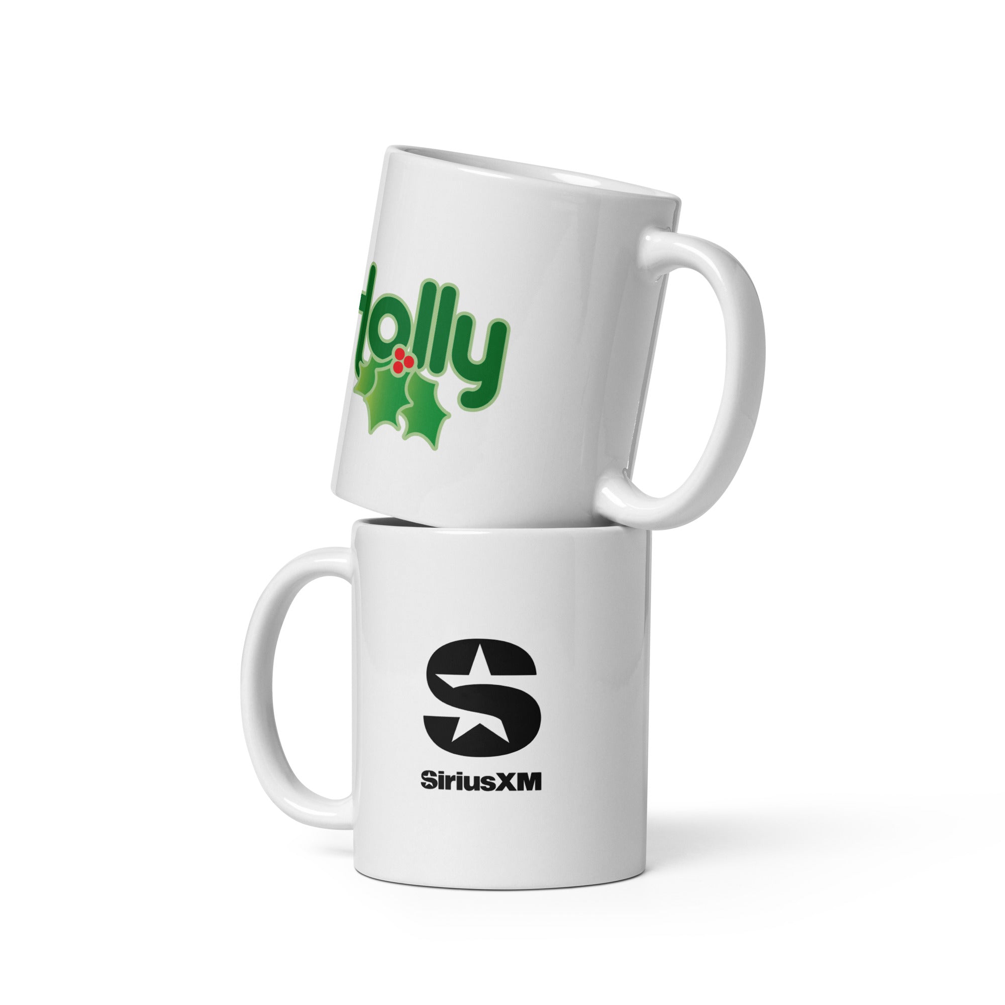 Two stacked white mugs showing opposite sides: one features the 'Holly' logo in green with holly leaves, while the other mug displays the SiriusXM logo.