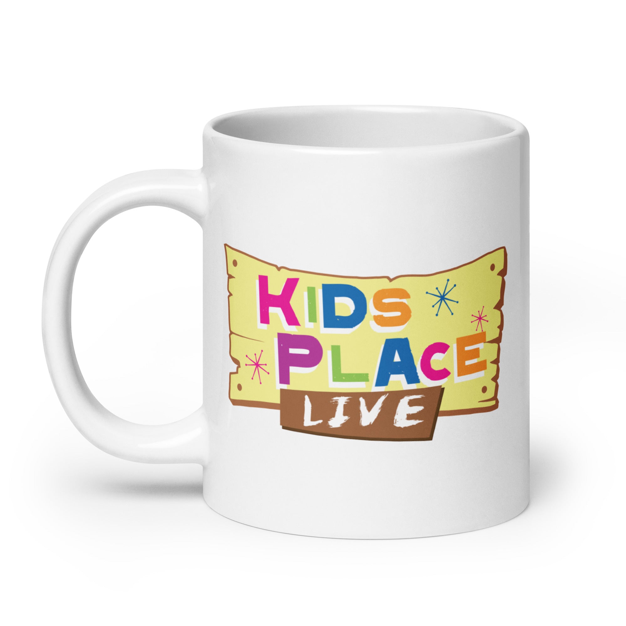 White coffee mug featuring the colorful logo 'KIDS PLACE LIVE' with colorful stars and a wooden sign illustration.