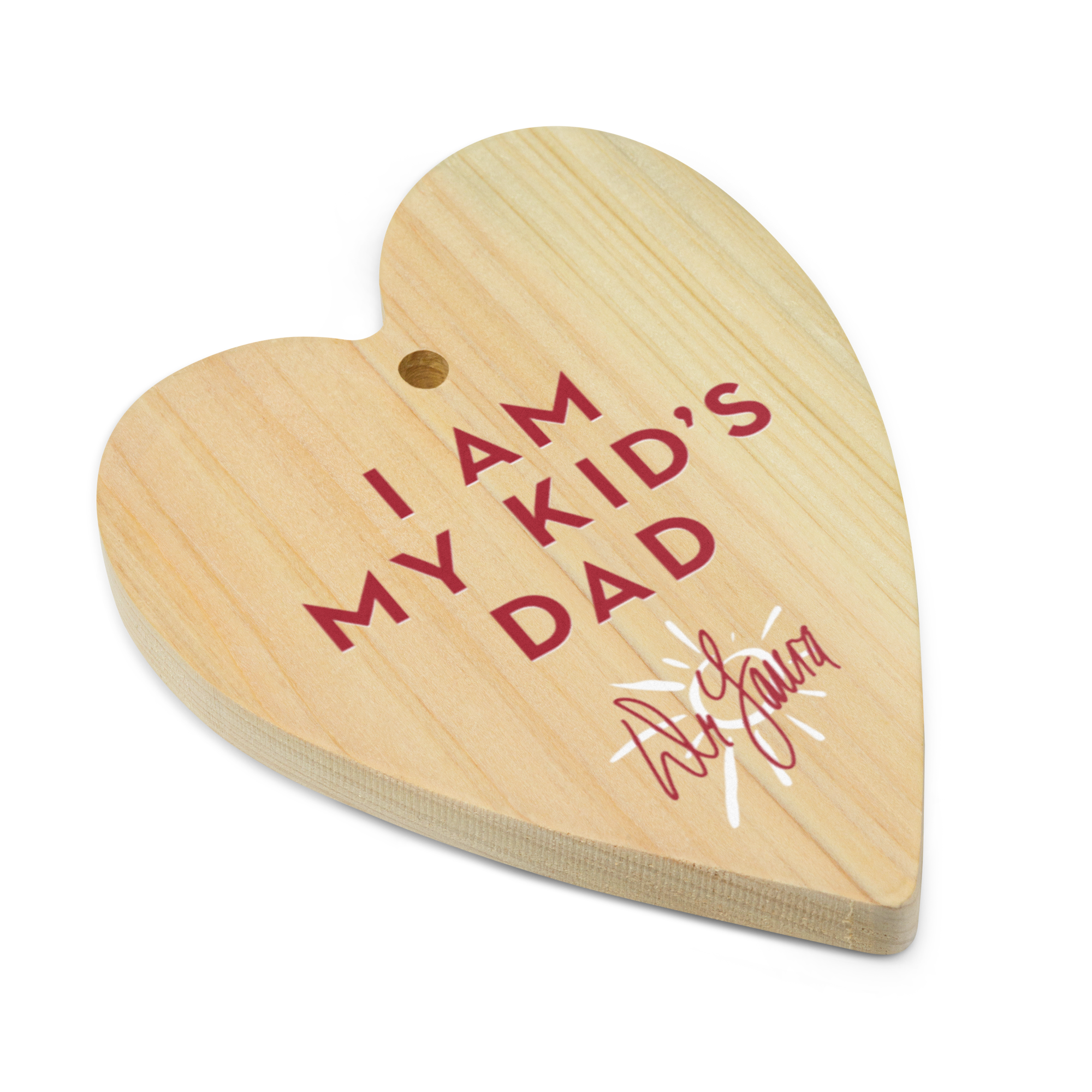 Wooden heart plaque with 'I AM MY KID'S DAD' text and a 'Dr. Laura' signature at the bottom.