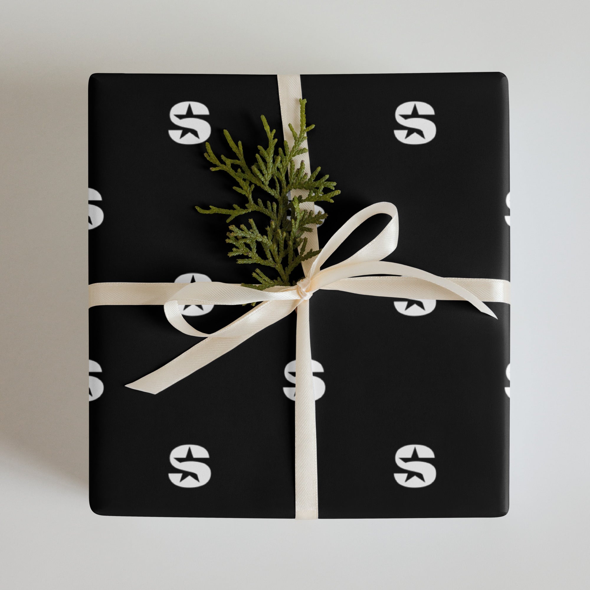 Gift in black wrapping paper featuring 'SiriusXM' branding.